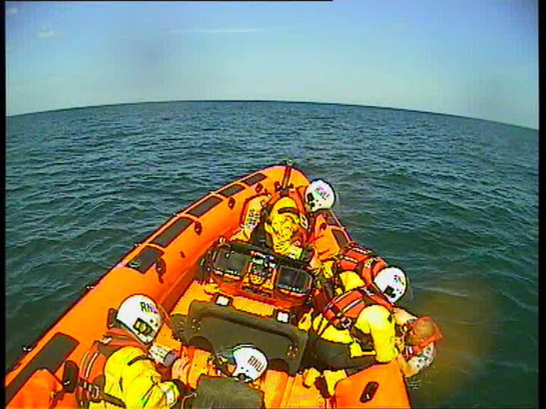 The casualty is brought onto the lifeboat