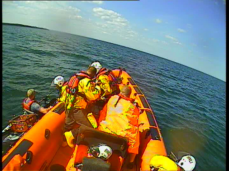Assisting the second kayaker