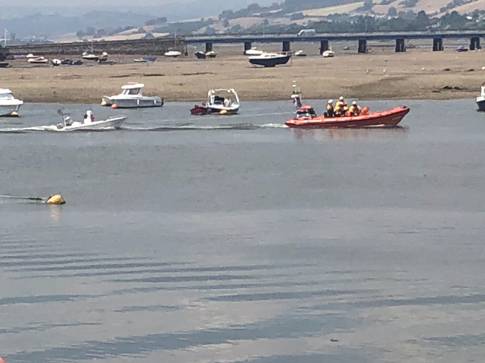 Teignmouth lifeboat crew tow in small rib