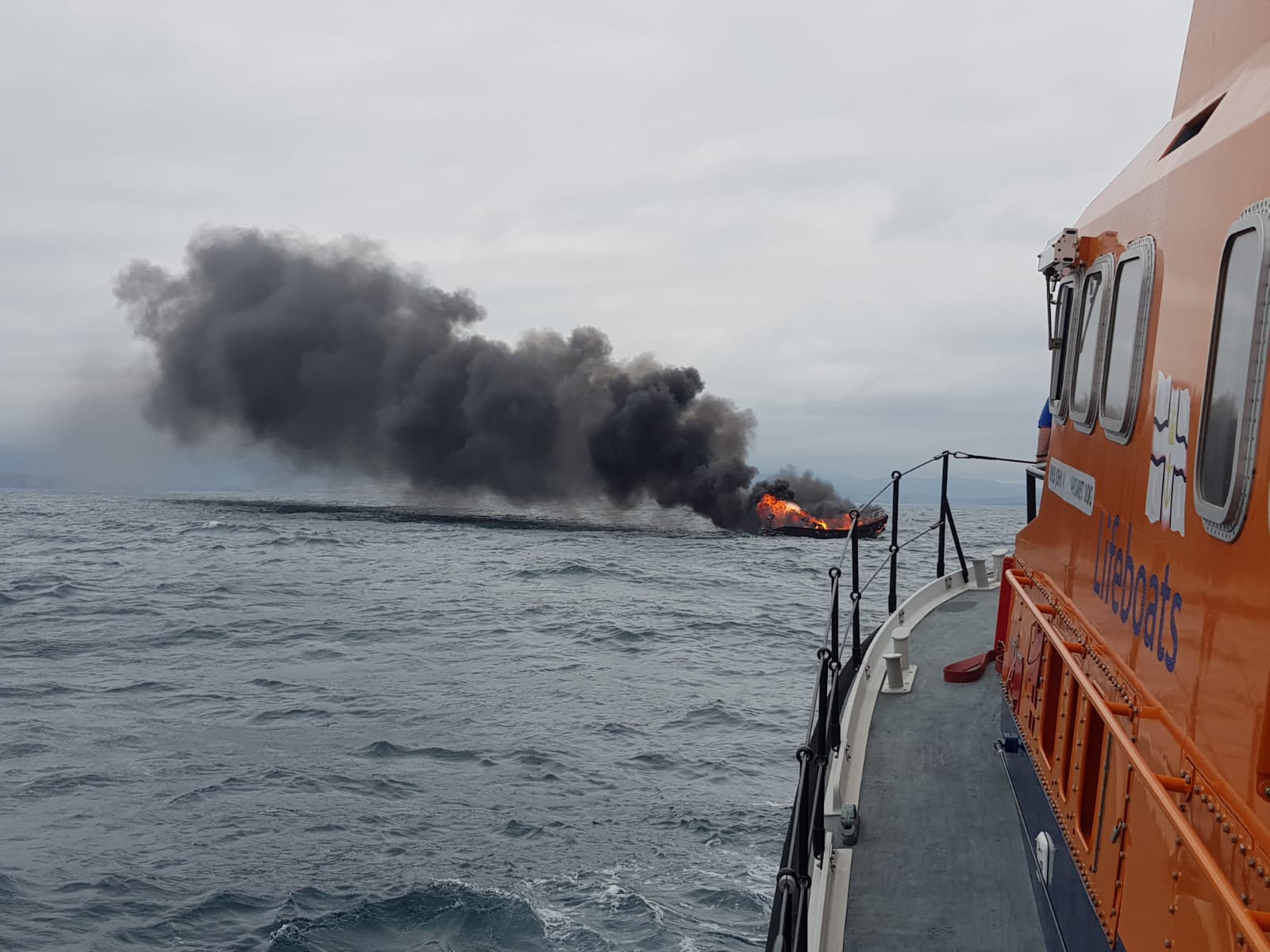 Valentia RNLI responds to boat on fire with three people onboard