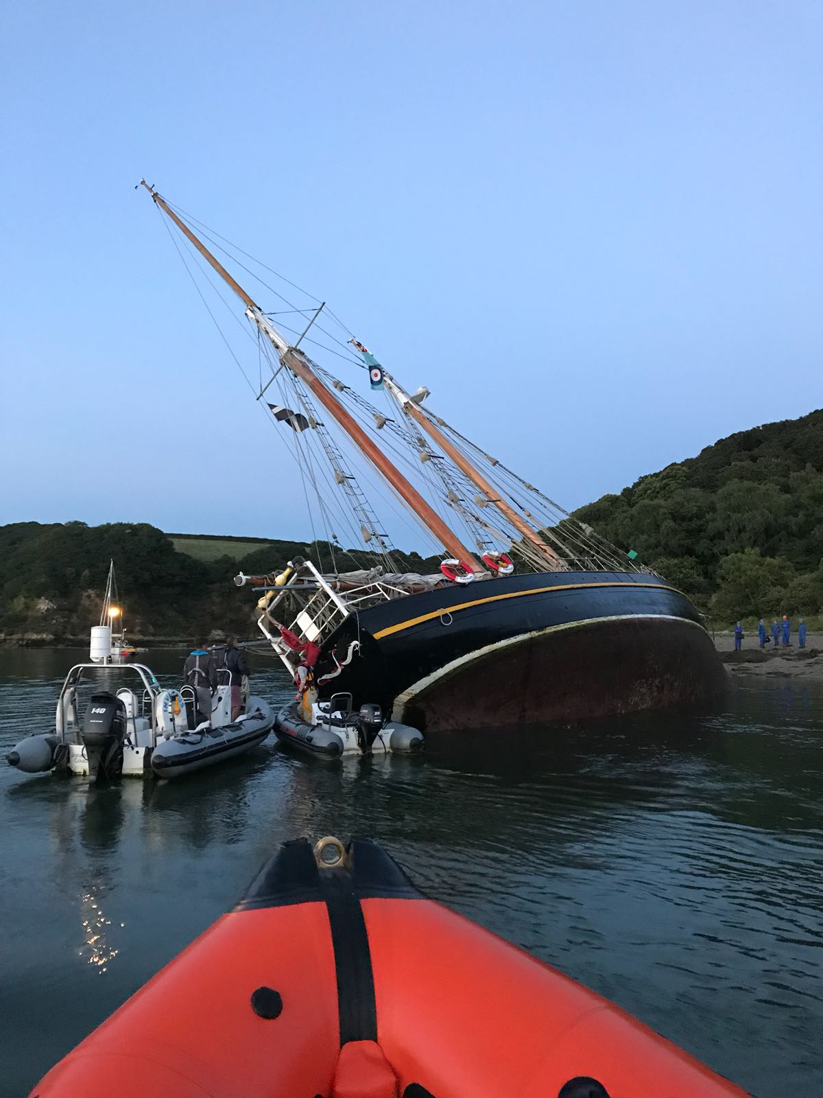 The schooner aground at Turnaware Point after suffering a mechanical failure