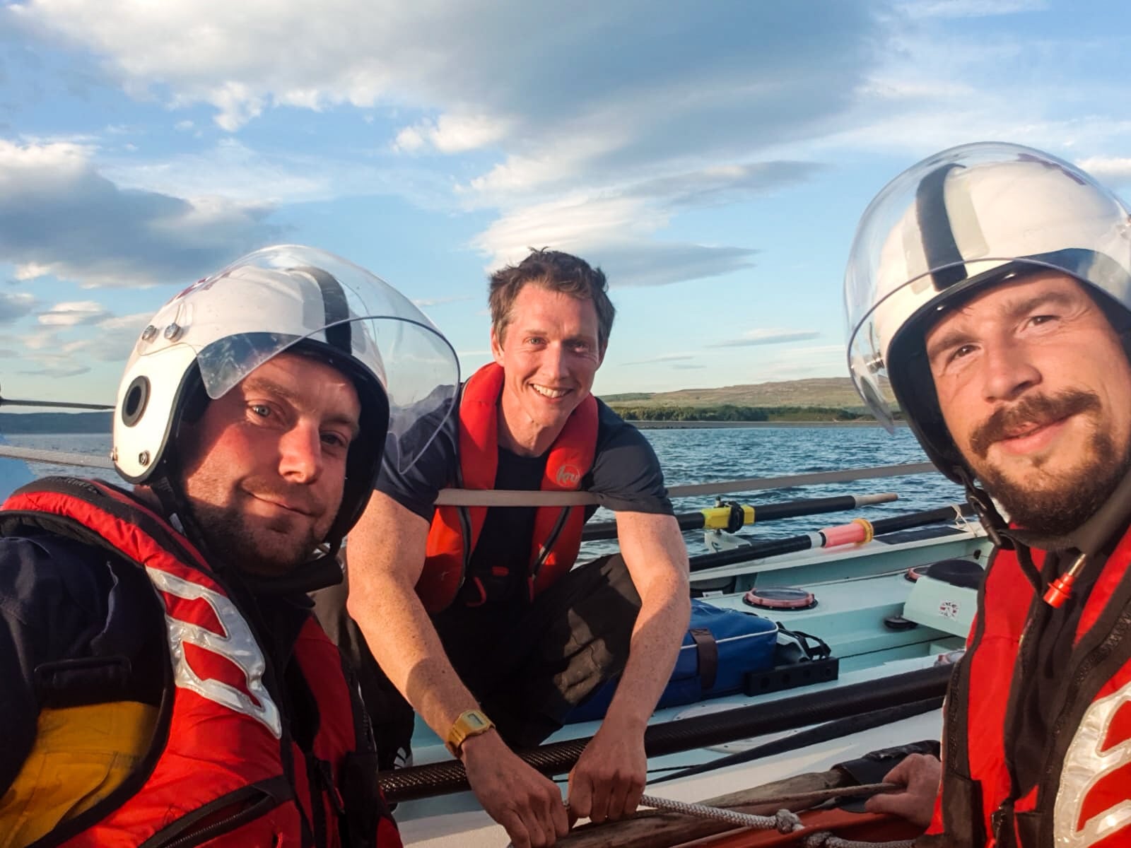 Coxswain David McHaffie and Volunteer Crew Iain 'Ogg' Mackenzie with charity ocean rower Andy Hodgson