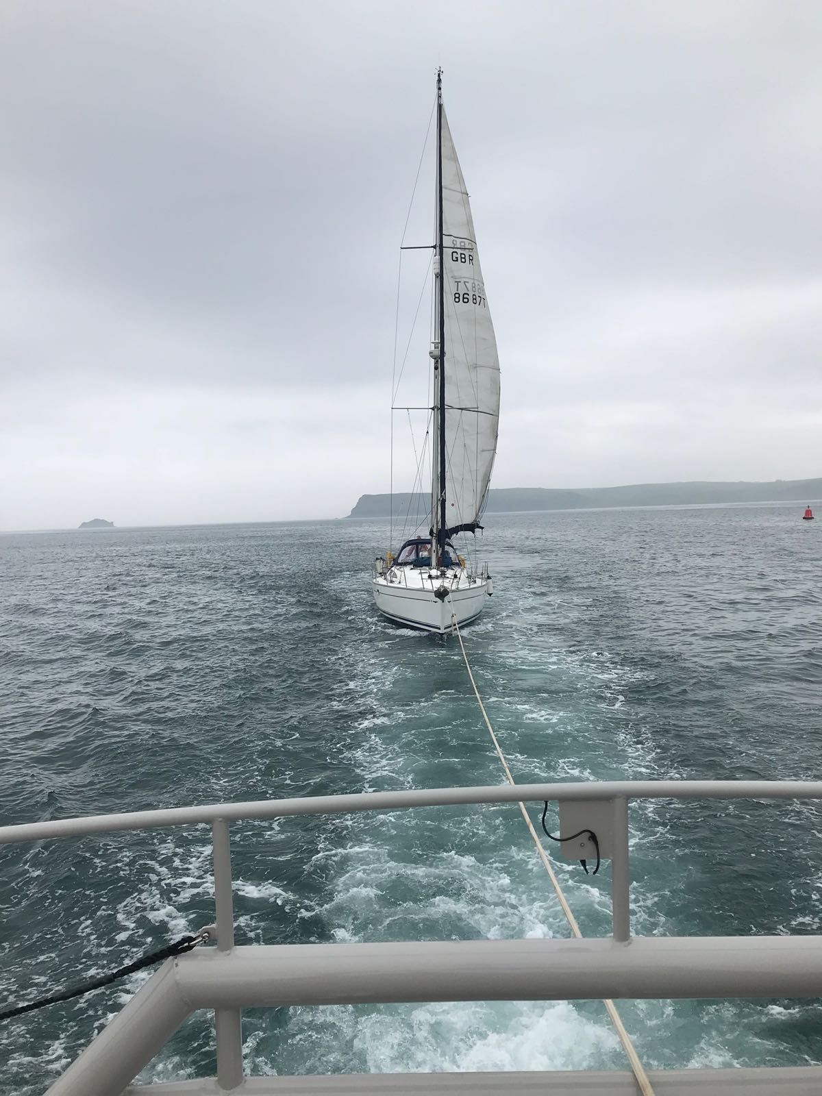yacht being towed by Padstow RNLI lifeboat