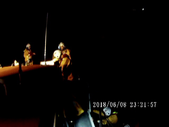 Peel RNLI volunteer crew in night time rescue for a boy on a beach