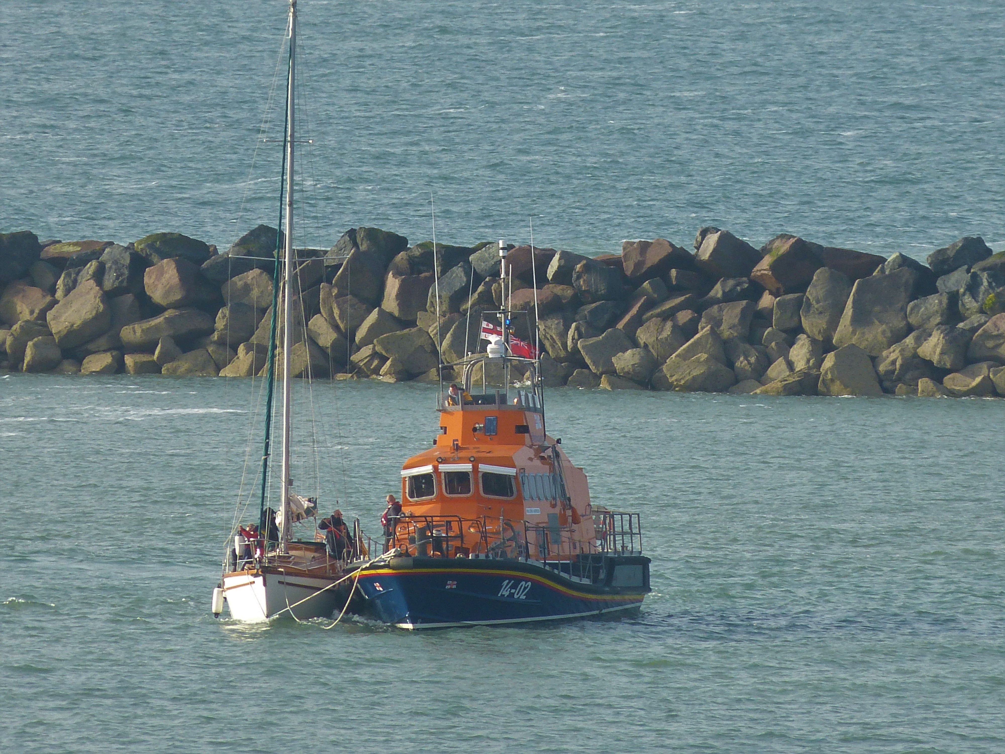 The yacht being brought alongside as it enters Ramsgate Harbour.