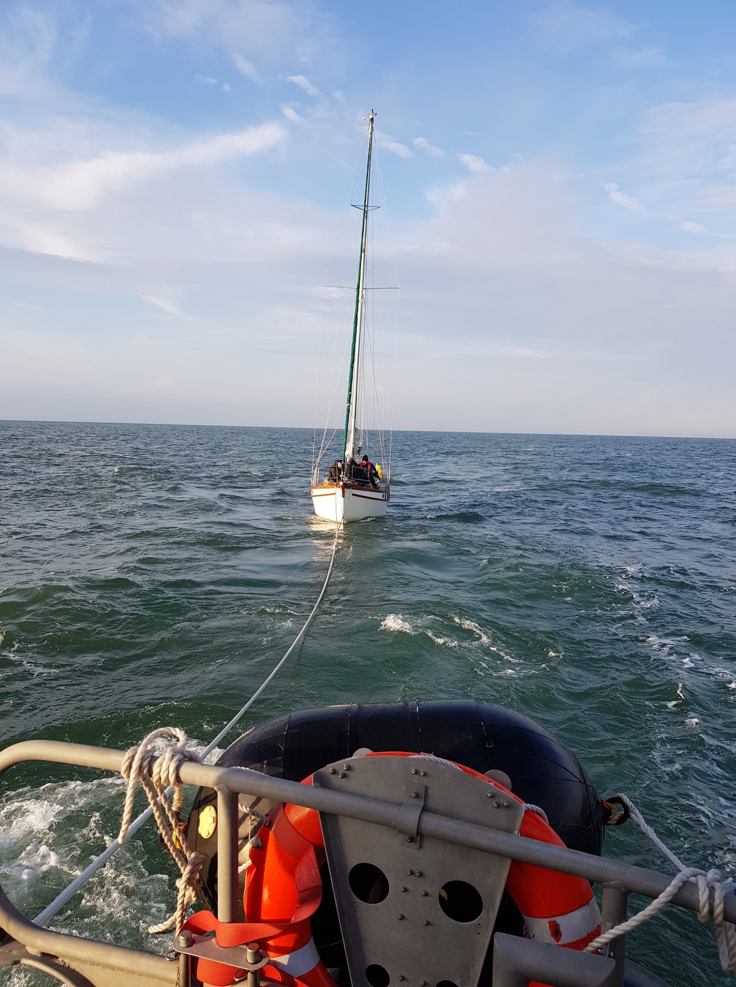 The yacht under tow
