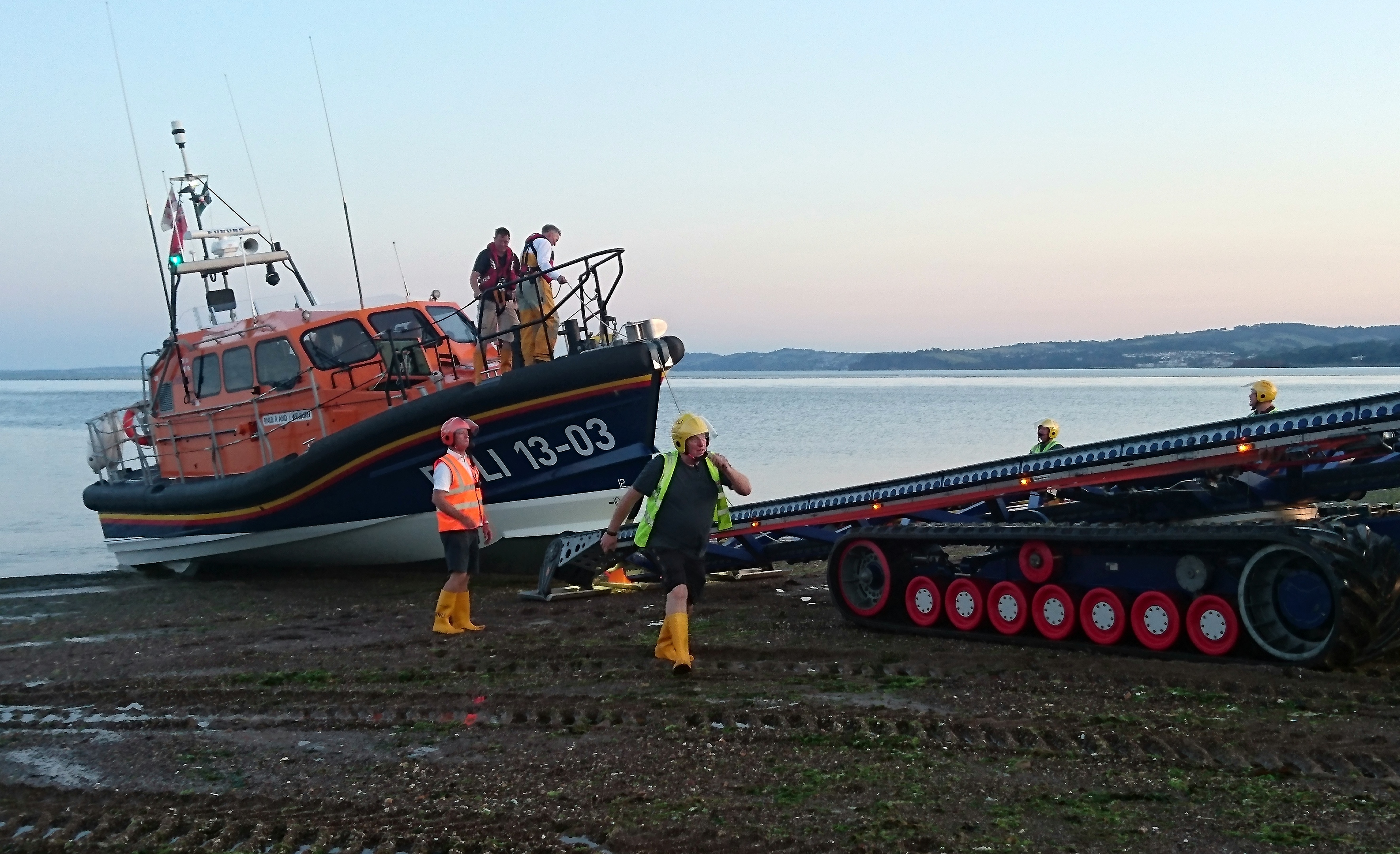 Shore Crew volunteers recover Shannon class lifeboat R and J Welburn on Exmouth beach