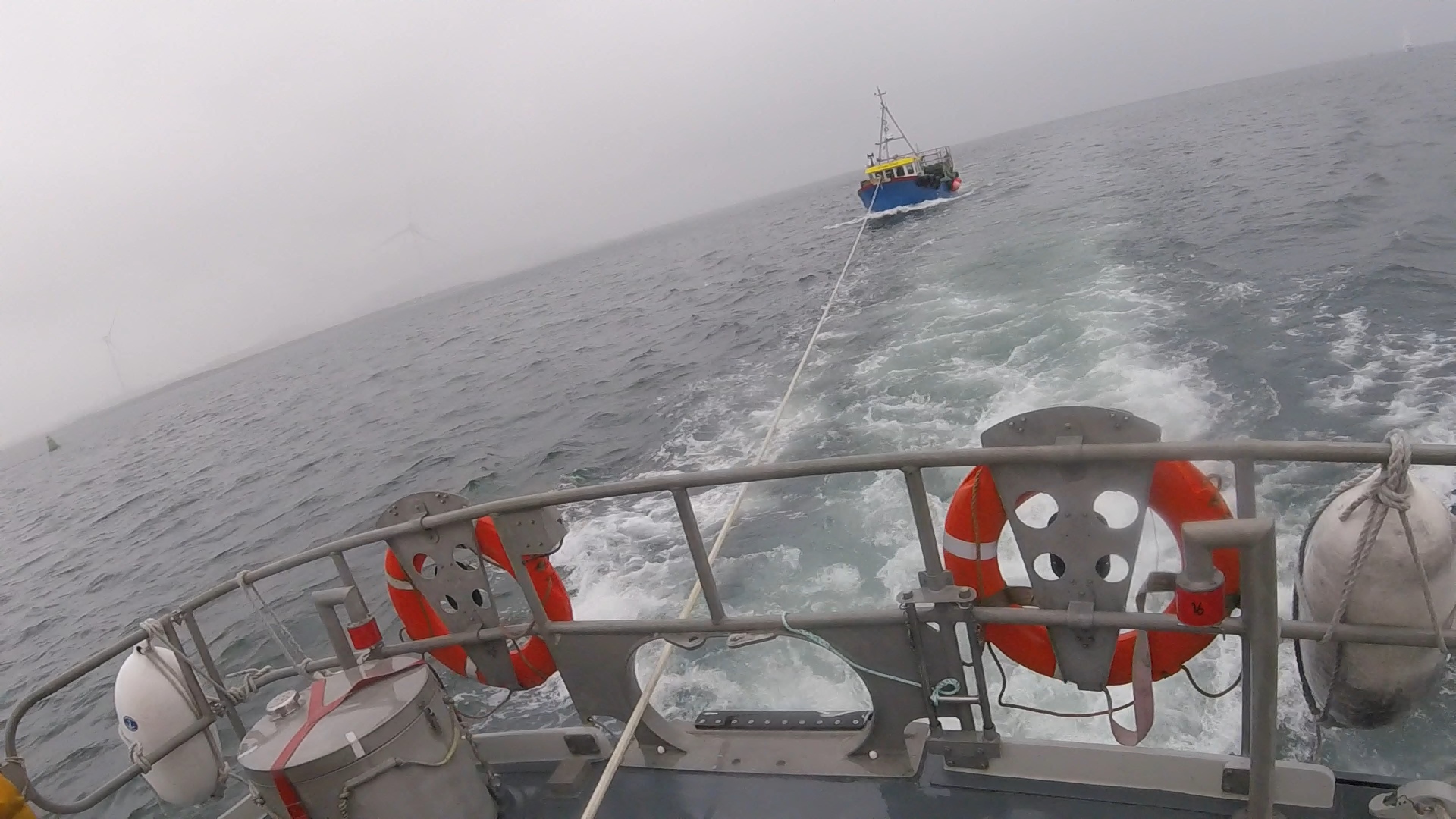 From the aft deck of Troon lifeboat the 10m Fishing vessel under tow