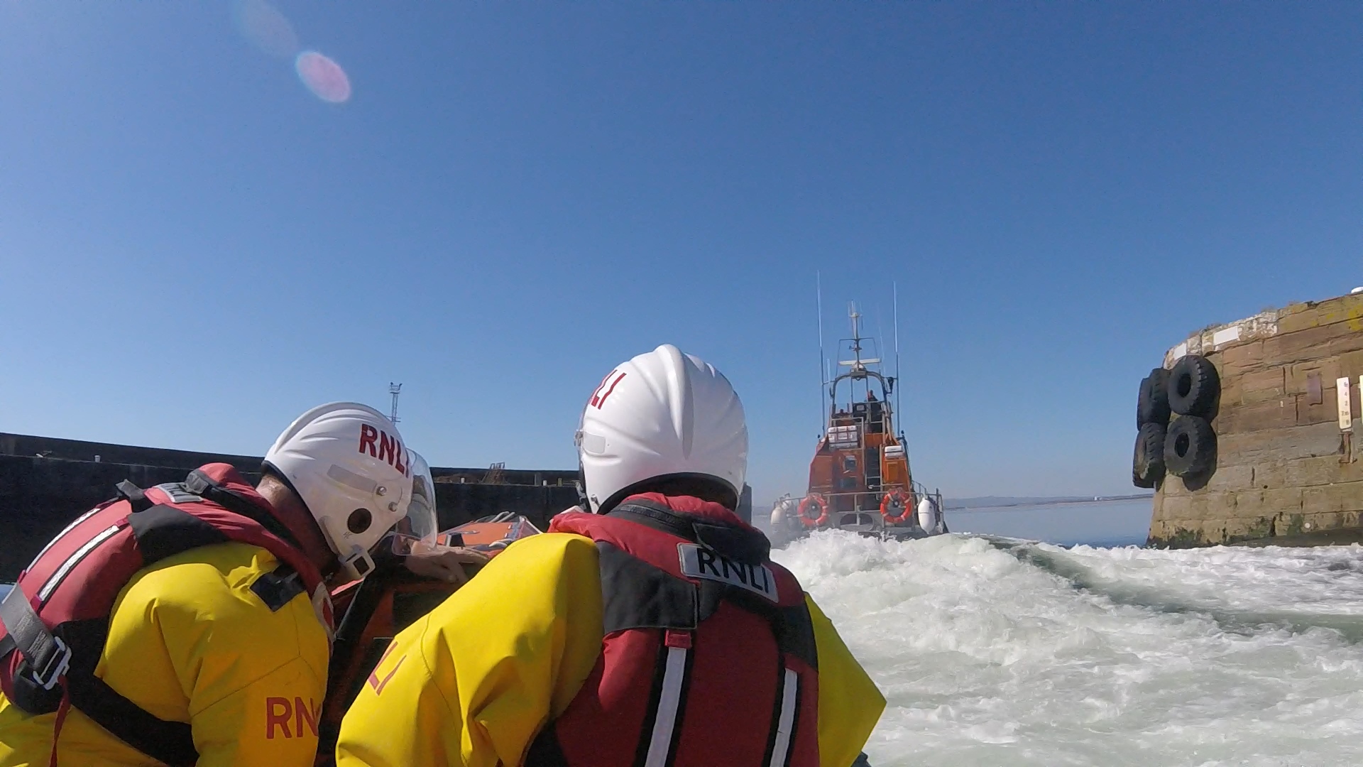 Troon all-weather and inshore lifeboats leaving Troon harbour launching on service