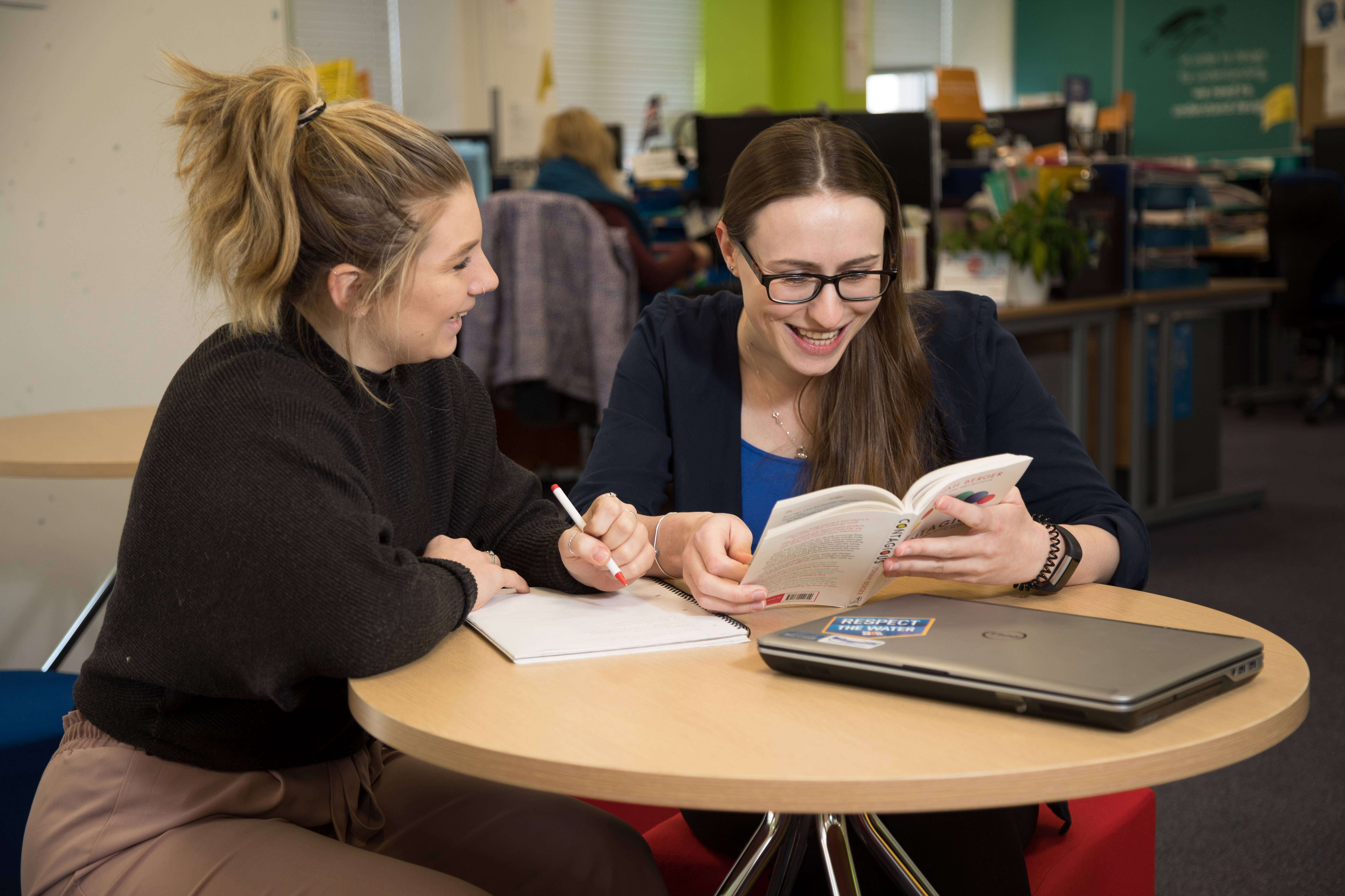 RNLI Marketing Apprentice Lauren (left) being helped by Laura, who finished her marketing apprenticeship with the RNLI last year.