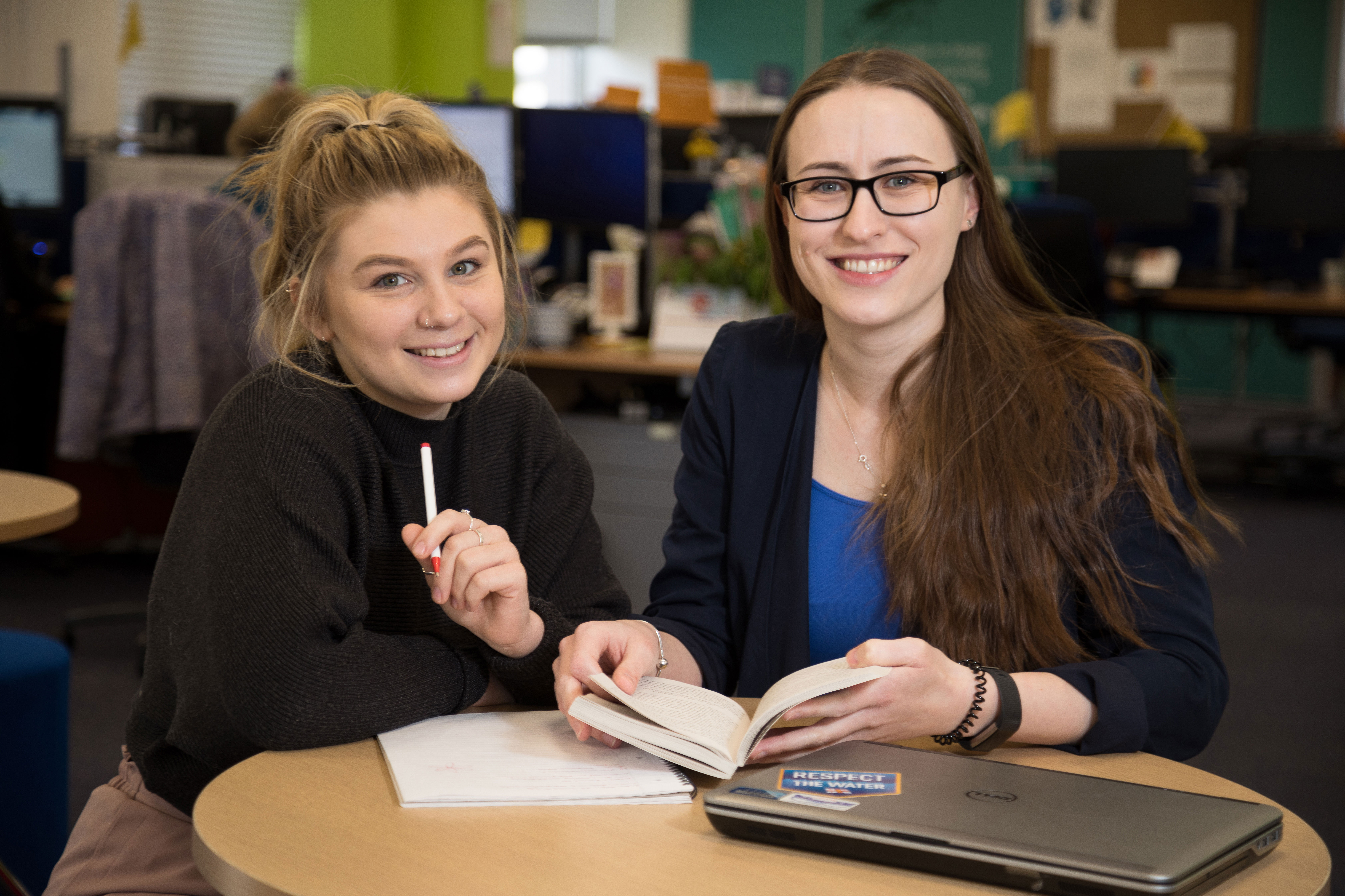 RNLI Marketing apprentice Lauren Poole (left), being helped by Laura (right), who finished her marketing apprenticeship with the RNLI last year.