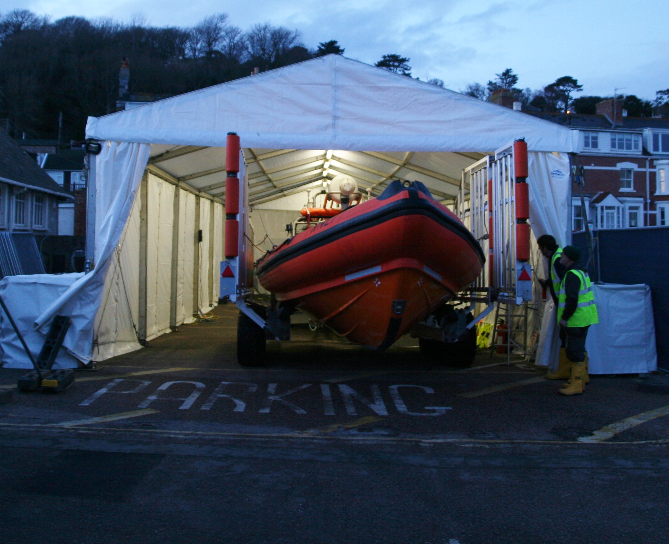 The RNLI's Lyme Regis lifeboat arrives in the tent.
