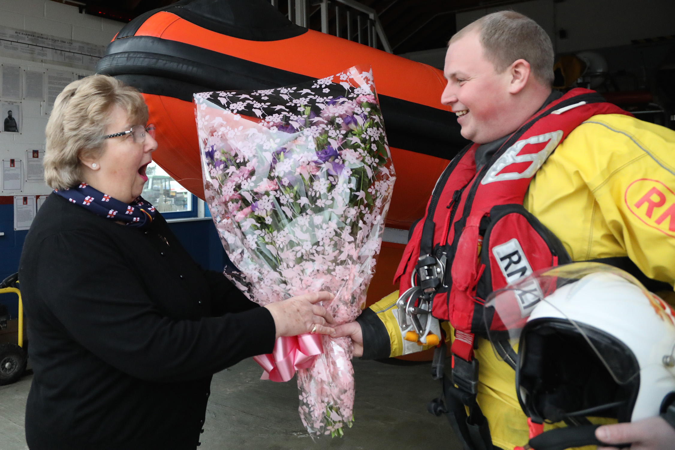 Crew member Jospeph Brown giving his mum Jean, flowers.