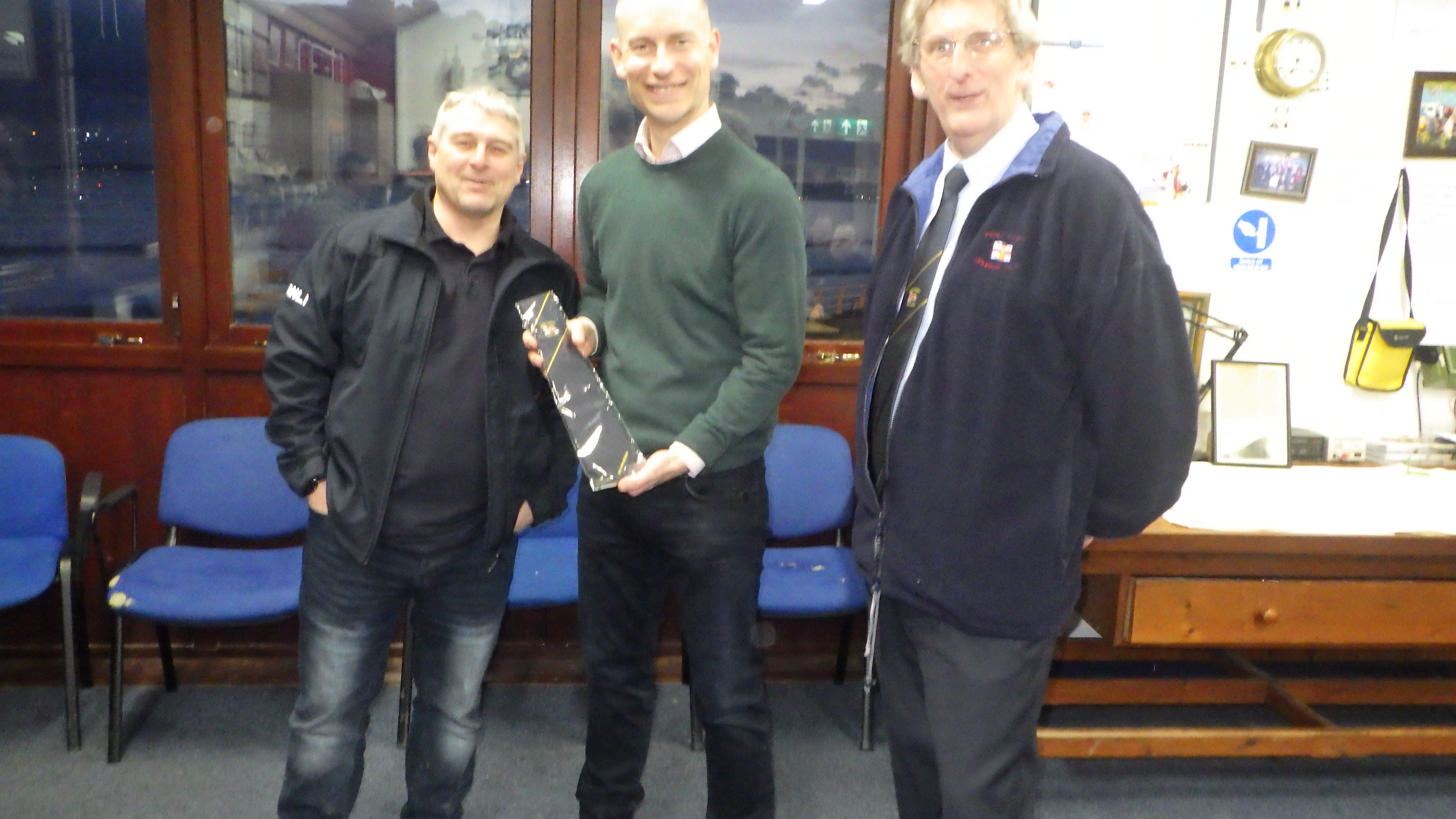 LOM Clive Morris (left) presents a tie to local MP Stephen Kinnock (centre) with station president William Hopkins