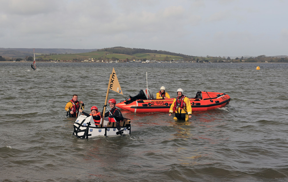 Exeter University students test All a-cardboard under the watchful eyes of Exmouth RNLI volunteers