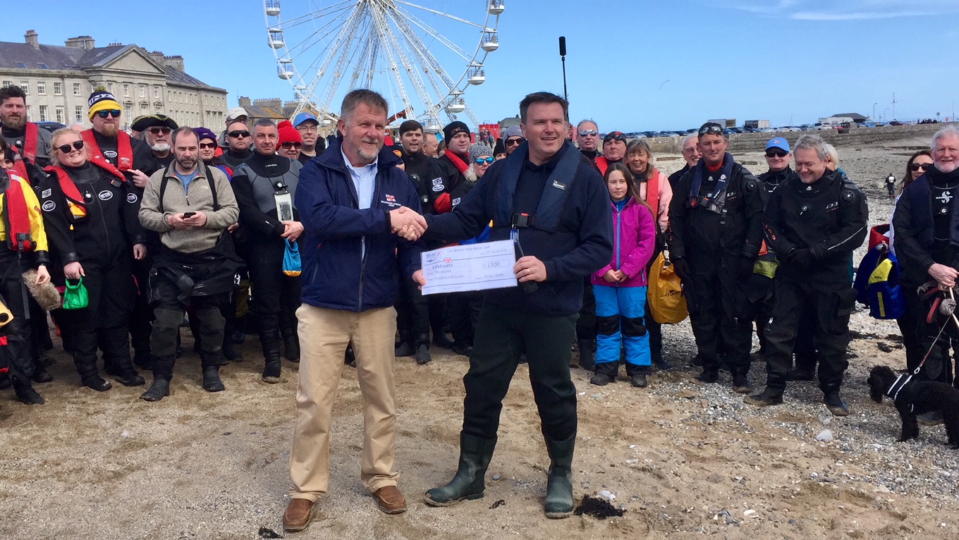 The cheque being presented to the Deputy Launching Authority