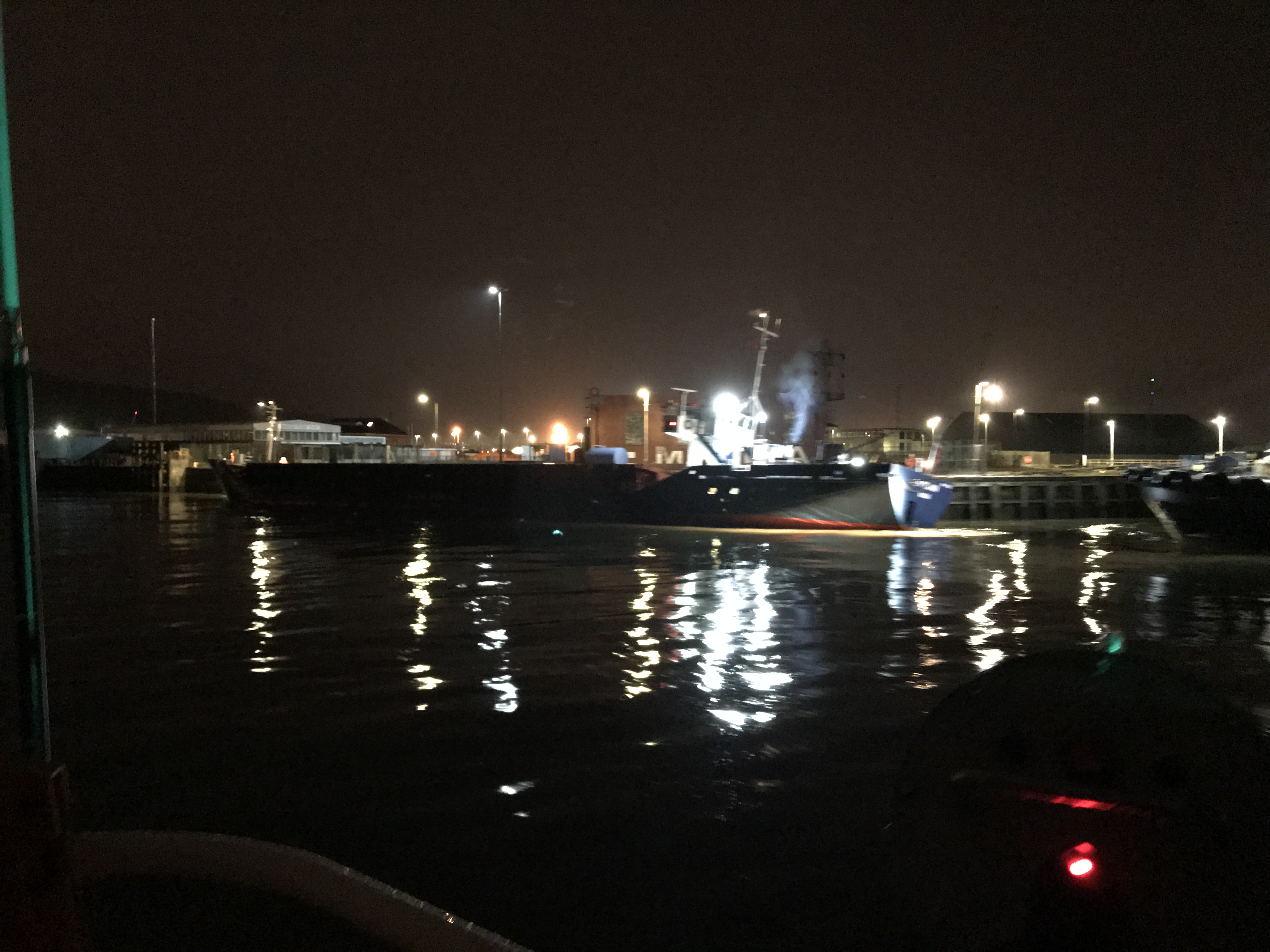 Ship against harbour wall