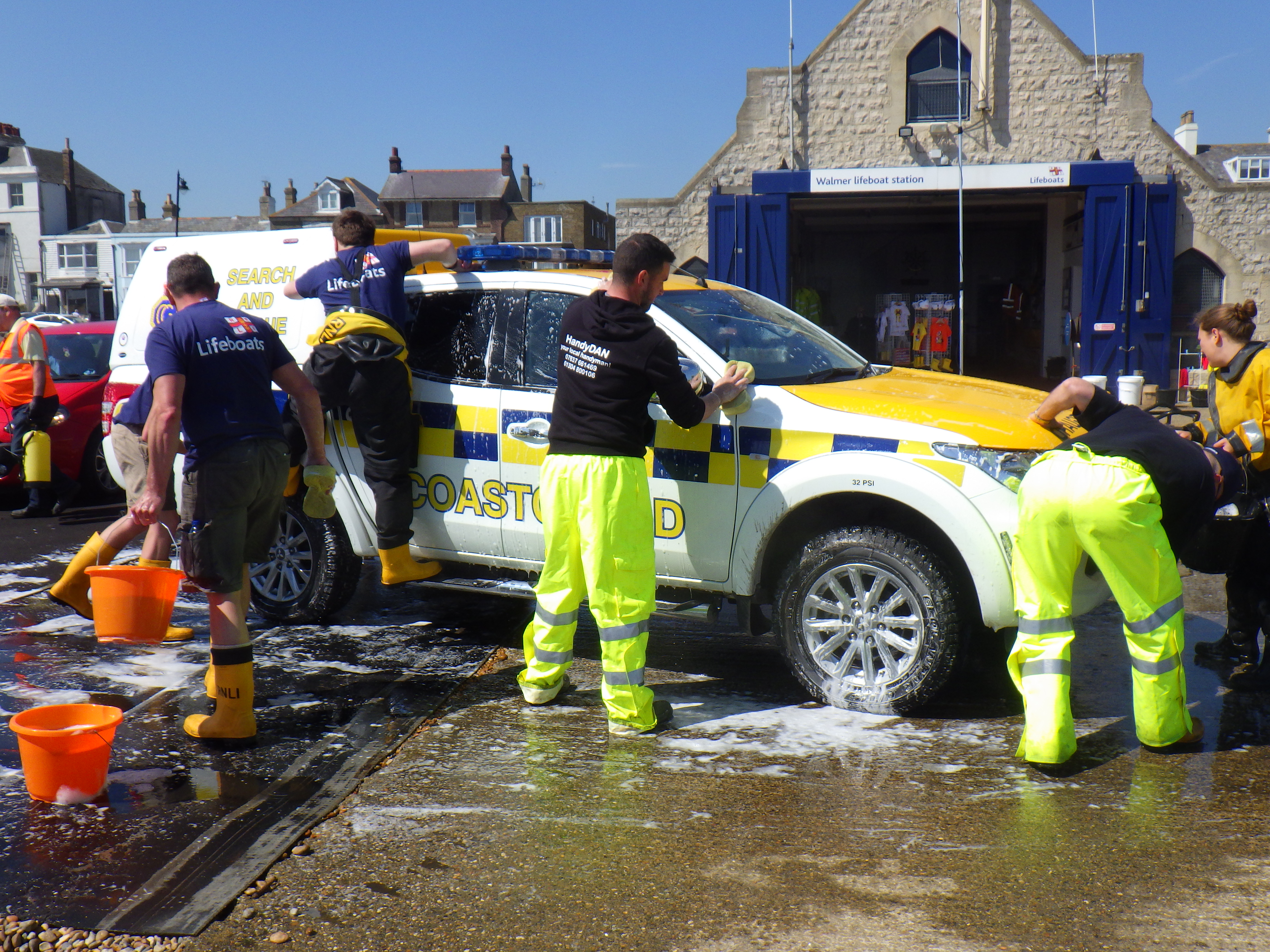 Cleaning the UK Coastguard pick up.
