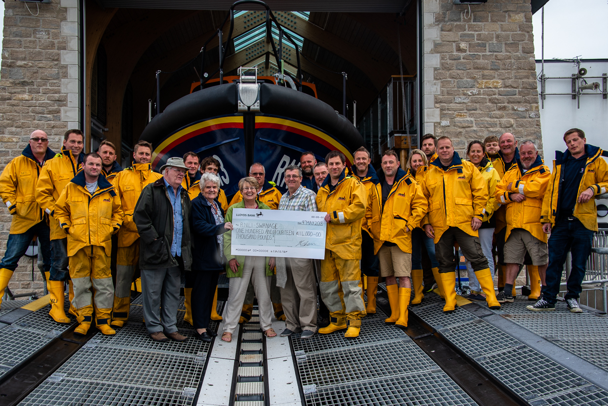 Coxswain Dave Turnbull receives cheque on behalf of Swanage Lifeboat Station