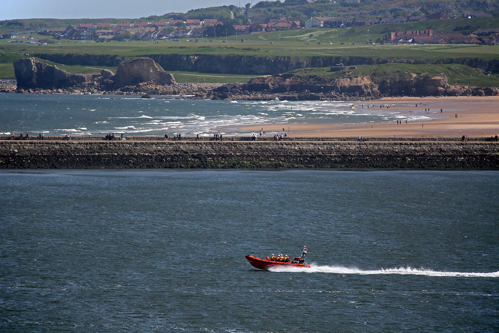 19 May 2018 THREE teenagers have been saved from drowning at South Shields in a multi-agency rescue involving Cullercoats and Tynemouth RNLI lifeboats. This Pic: Cullercoats RNLI lifeboat returns to sea after transferring the girl they rescued from drowning to the care of Paramedics. 
