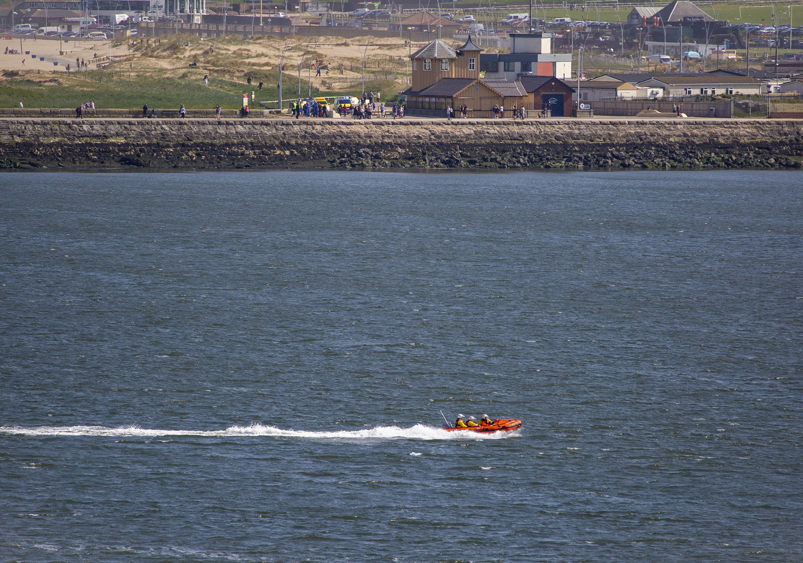 19 May 2018 THREE teenagers have been saved from drowning at South Shields in a multi-agency rescue involving Cullercoats and Tynemouth RNLI lifeboats. This Pic: This Pic: Tynemouth RNLI inshore lifeboat speeds to South Shields ferry landing with two casualties on board. In the background other emergency service vehicles can be seen behind the South Shields VLB watchhouse