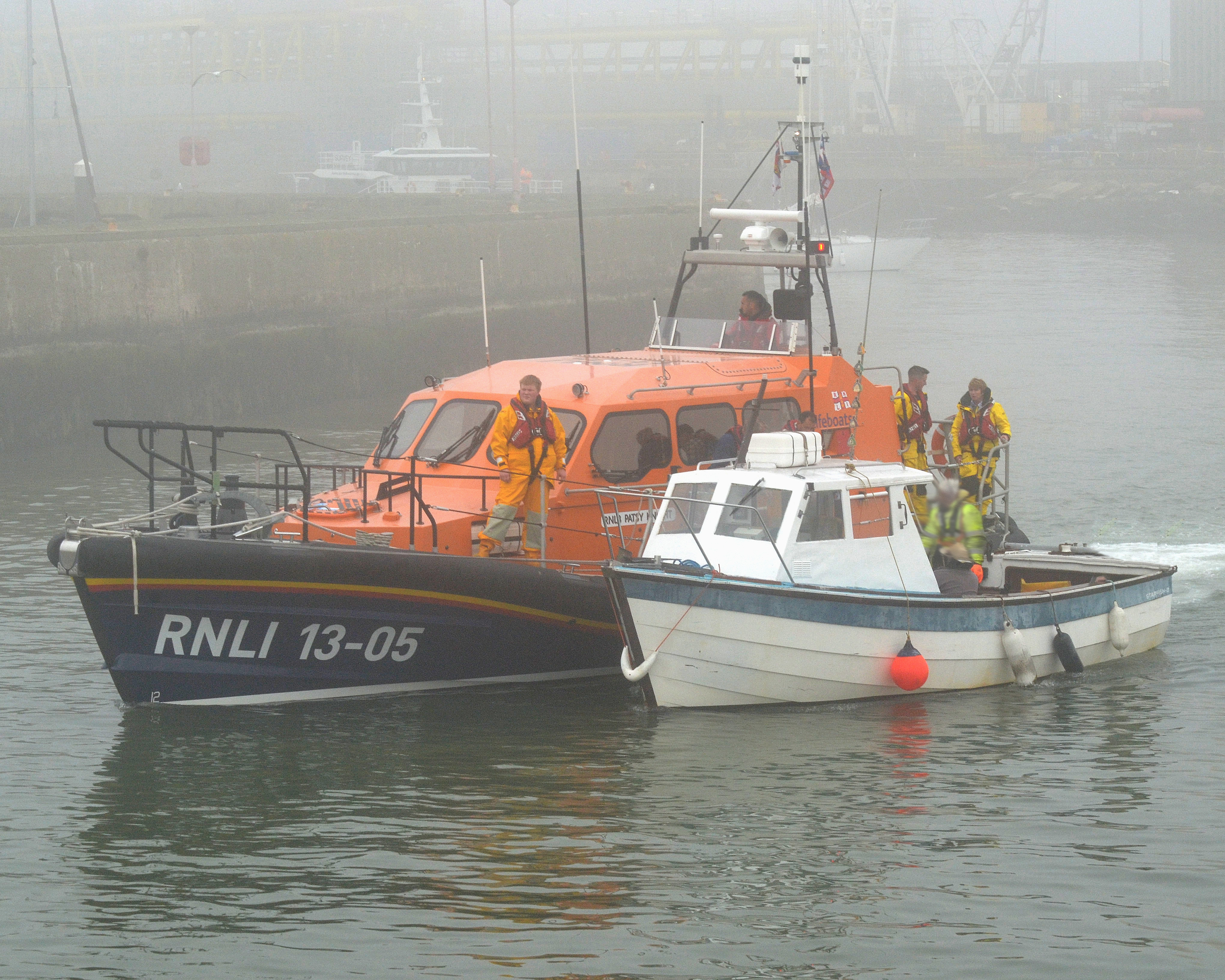 Lowestoft Lifeboat 'Patsy Knight' with the stranded angling boat in a sea fog