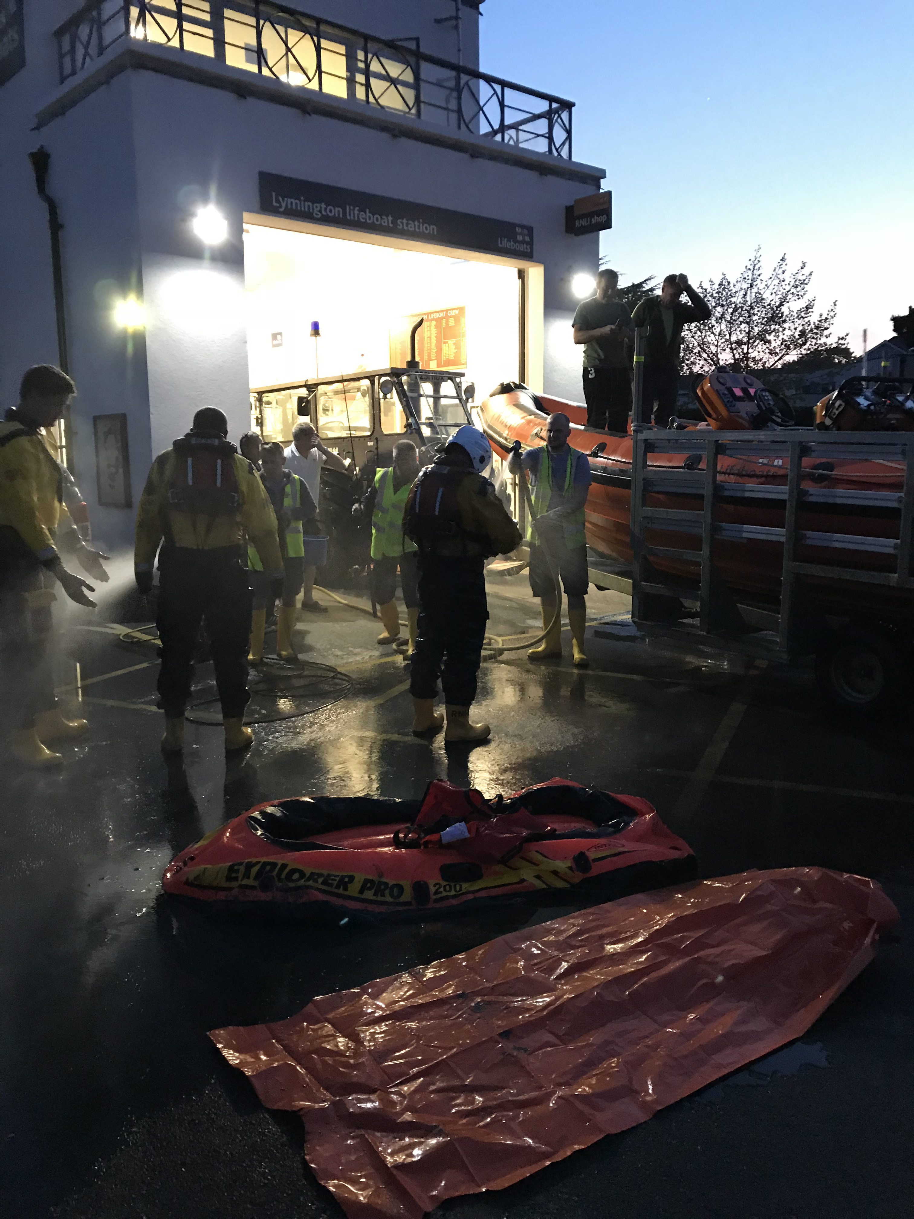 Lymington RNLI Boat and Crew washdown after a mud rescue