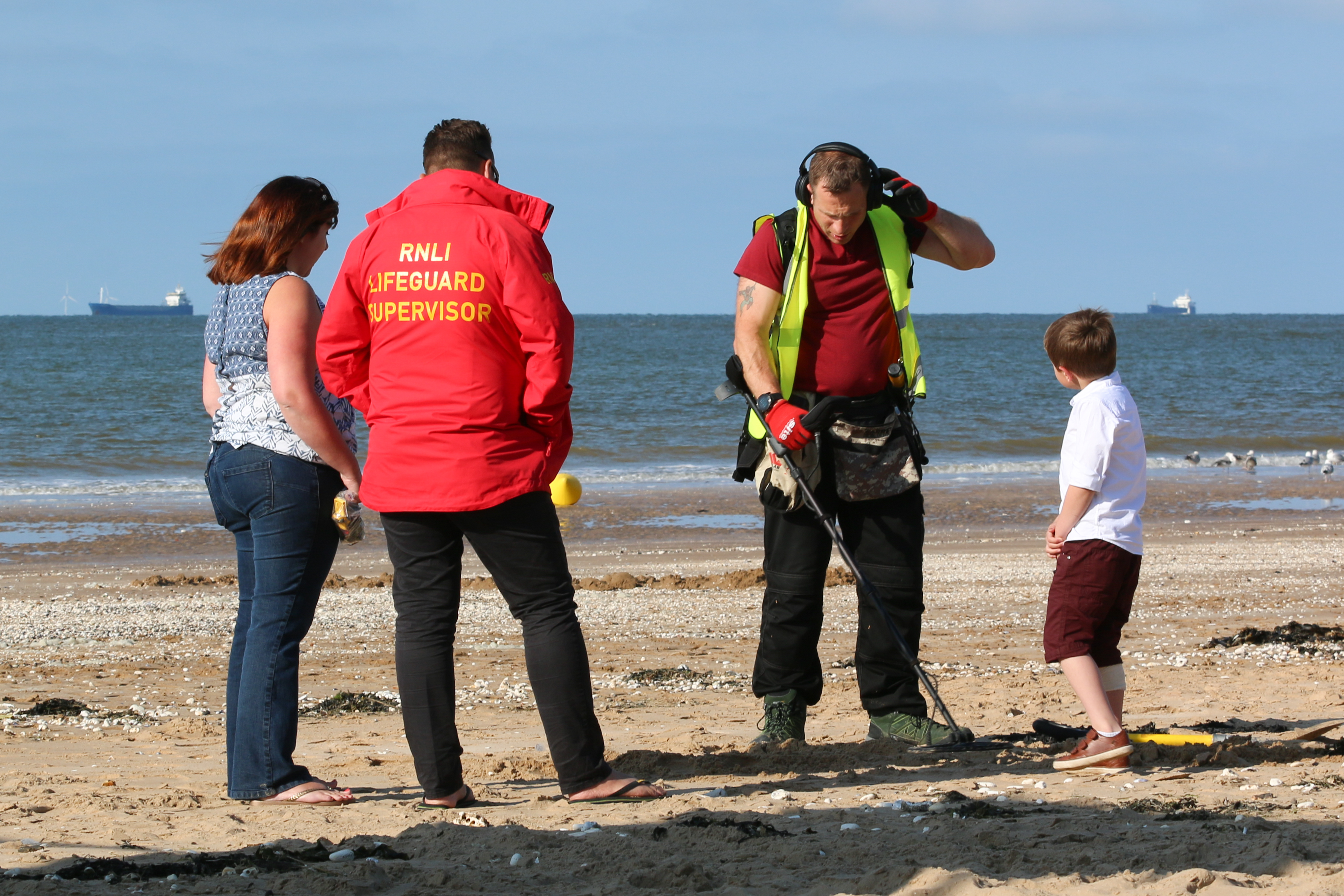 Henry helps volunteers scan the beaches