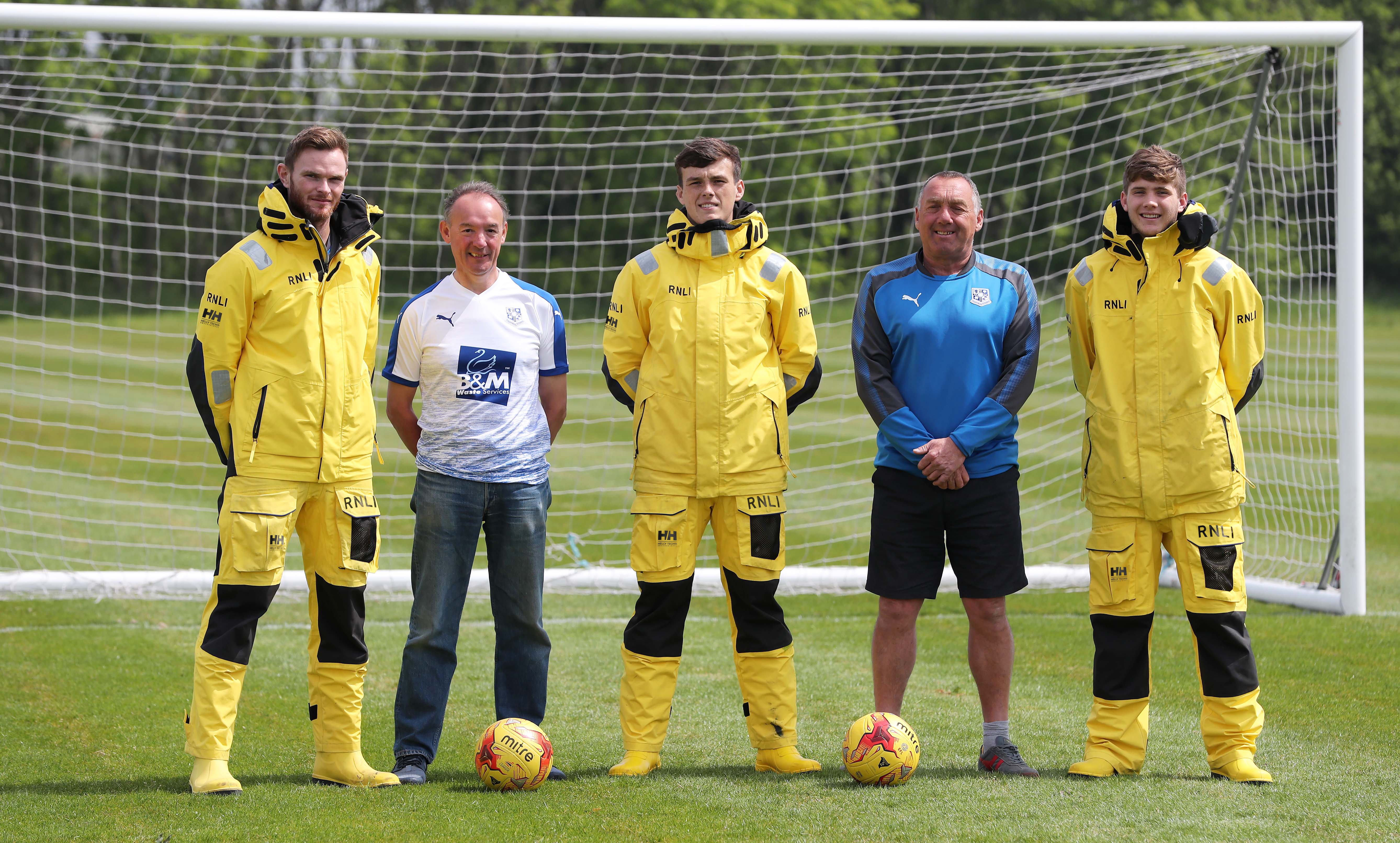Tranmere Rovers players with crew from Hoylake station