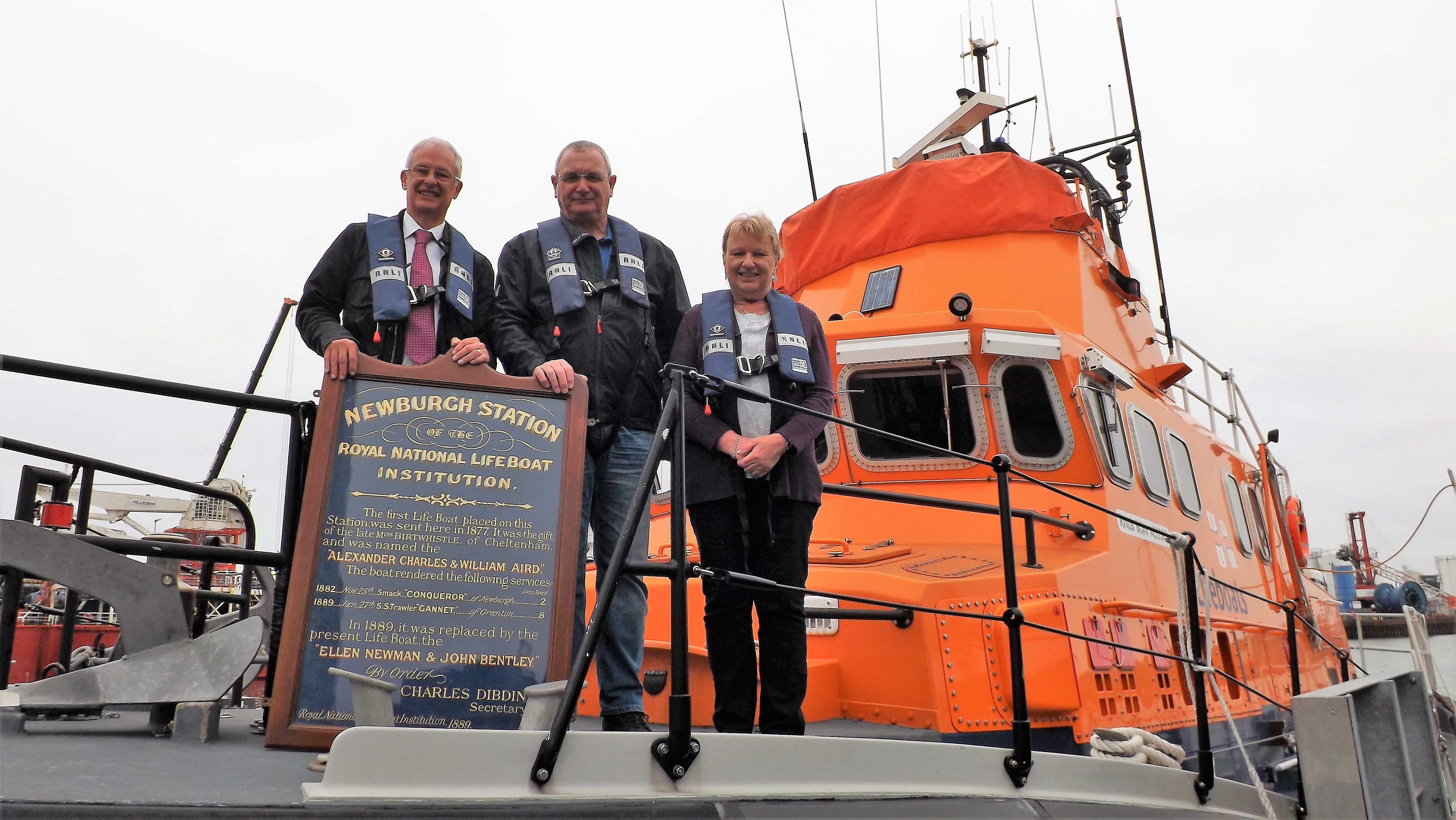 Keith Webb (left) presents a Newvburgh-on-Ythan Lifeboat Station service board dated 1889 to Bill Deans (centre), Aberdeen Lifeboat operations manager and Bec Allen (right), honorary secretary of Aberdeen Branch, RNLI