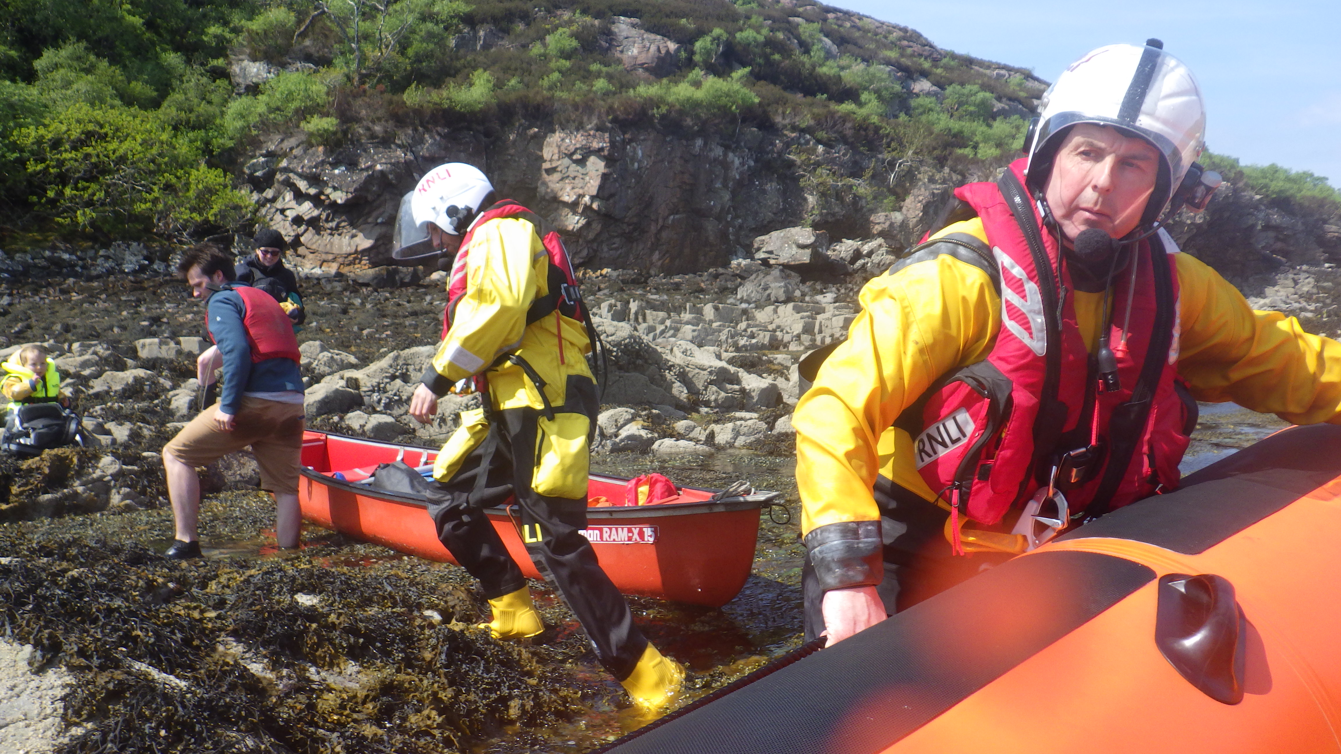 Kyle of Lochalsh volunteer lifeboat crew go ashore to assist a group of kayakers