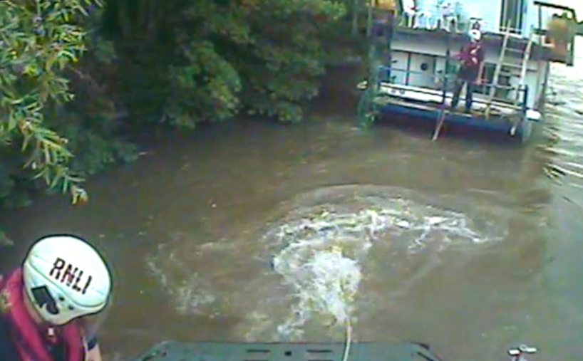 Houseboat under tow