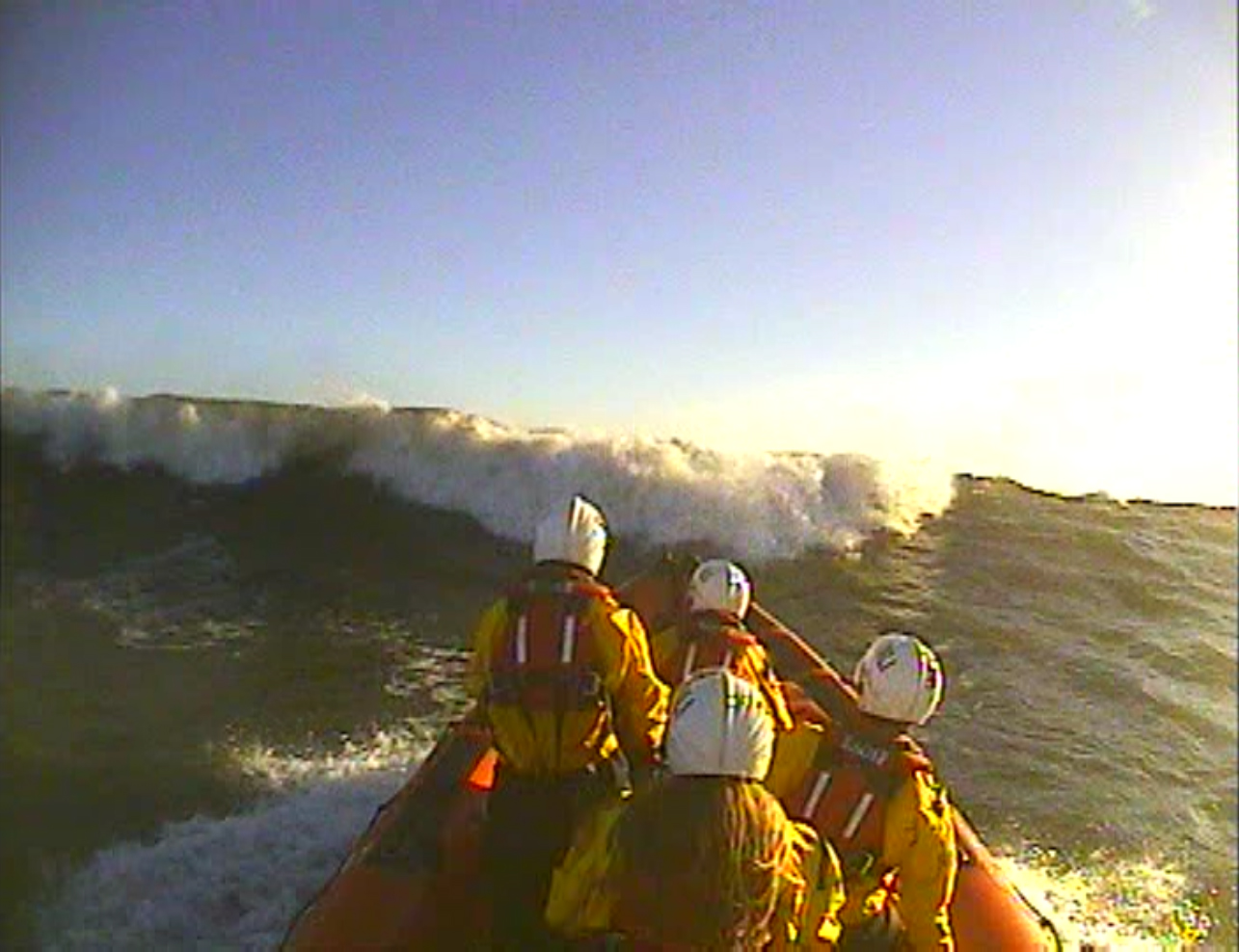 Cullercoats RNLI B class Atlantic 85 lifeboat approaches a large breaking wave during the search.
