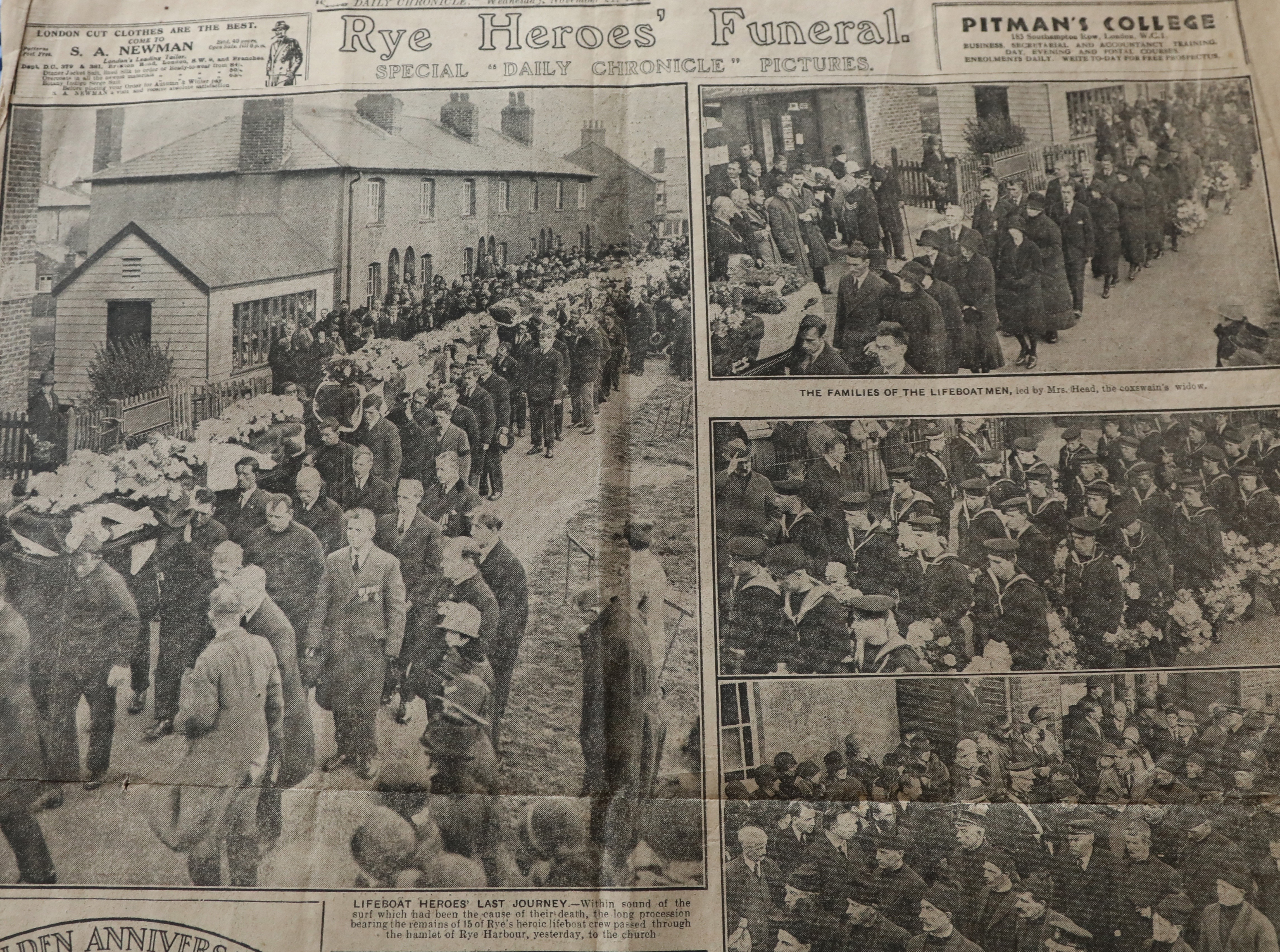 photograph of old newspapers held in the village