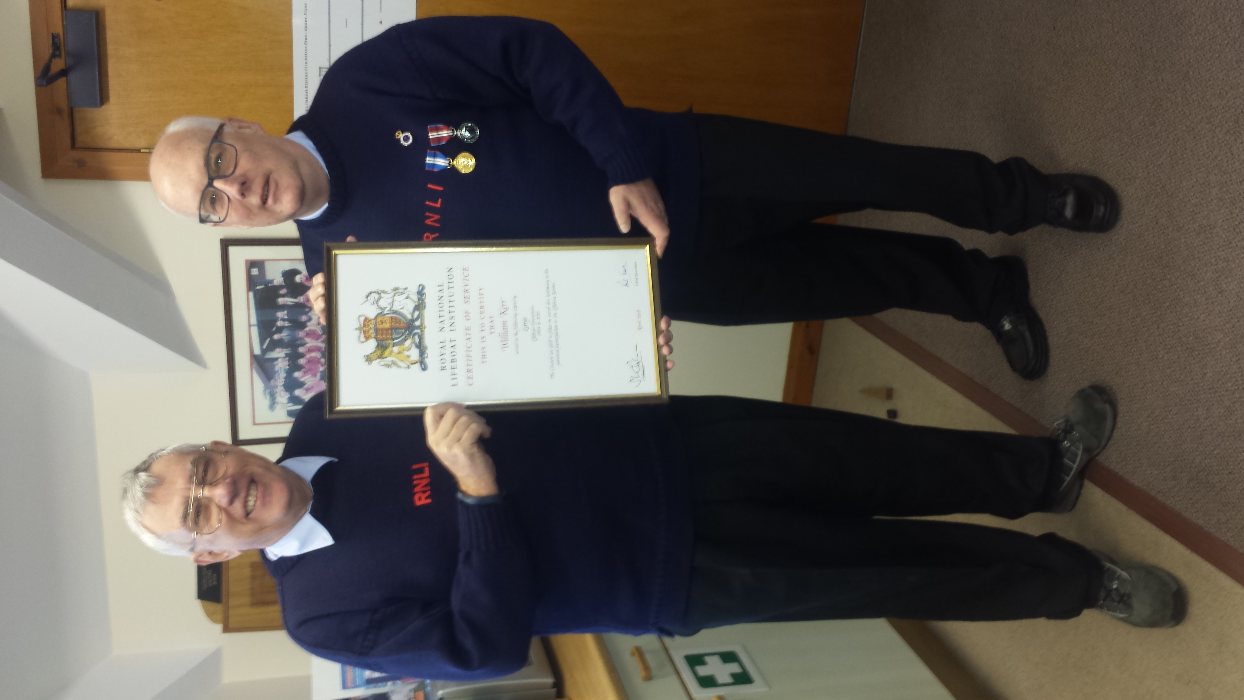 Bill receiving his award from LOM John Griffiths on the left