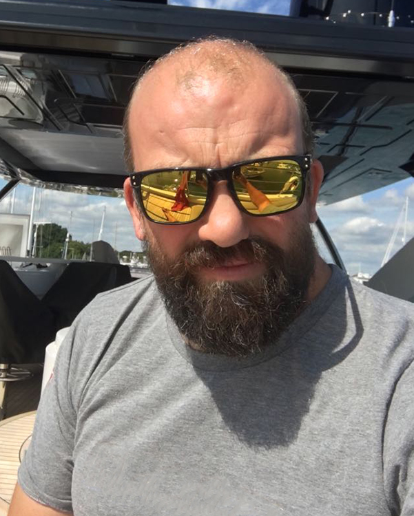Lymington RNLI - new helm - Jamie Lever relaxing off duty in a grey tee shirt