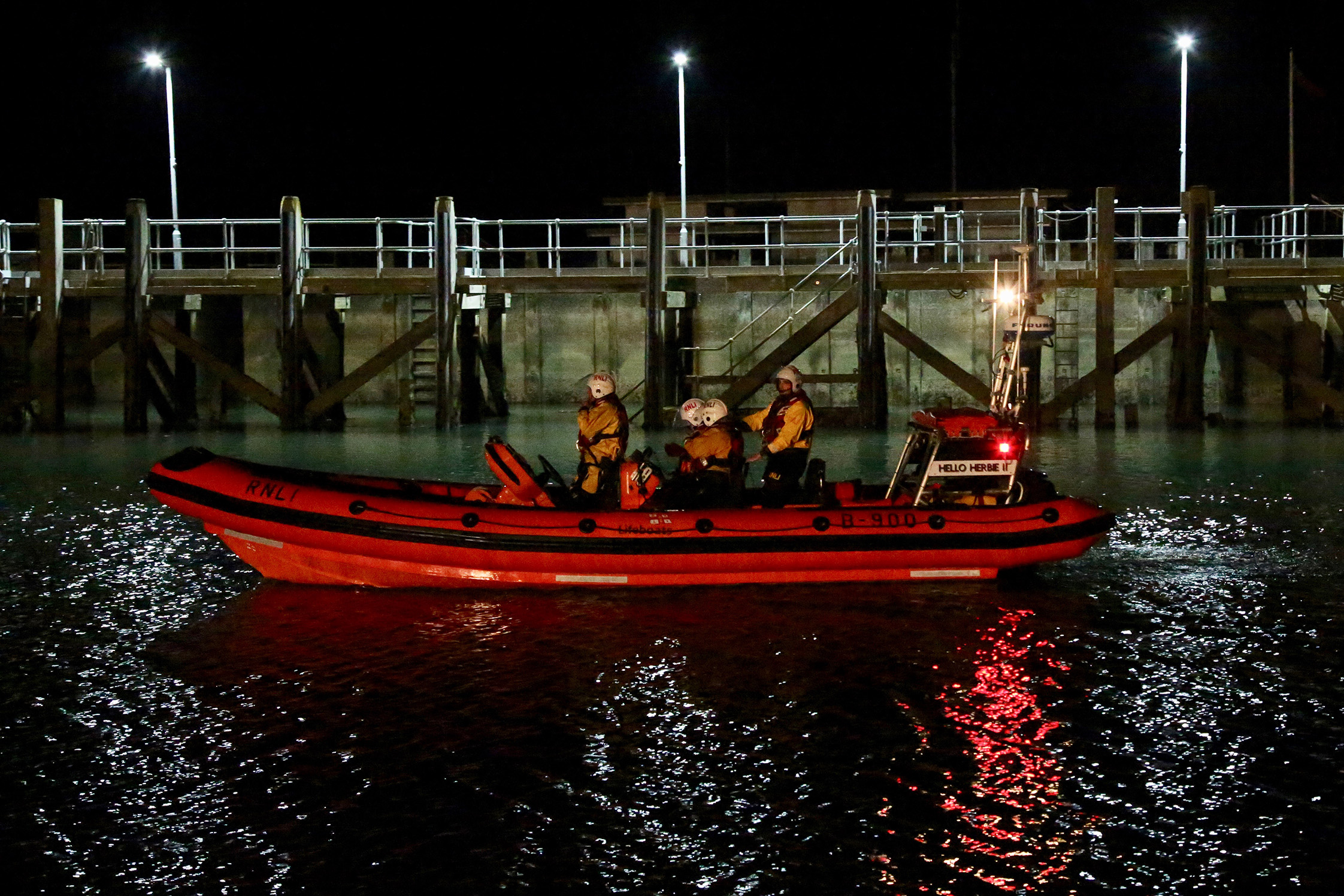 The lifeboat Hello Herbie II returns in darkness to the station at Rye Harbour