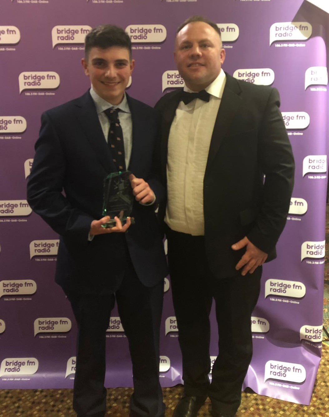 Ieuan receives his award from Ade Collins of Action Doors who sponsored the award