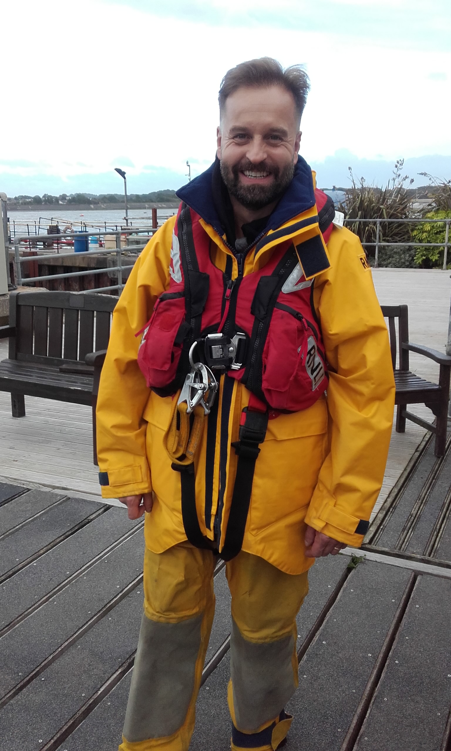 Alfie Boe, famous opera singer from Fleetwood, dressed in the RNLI's yellow waterproofs