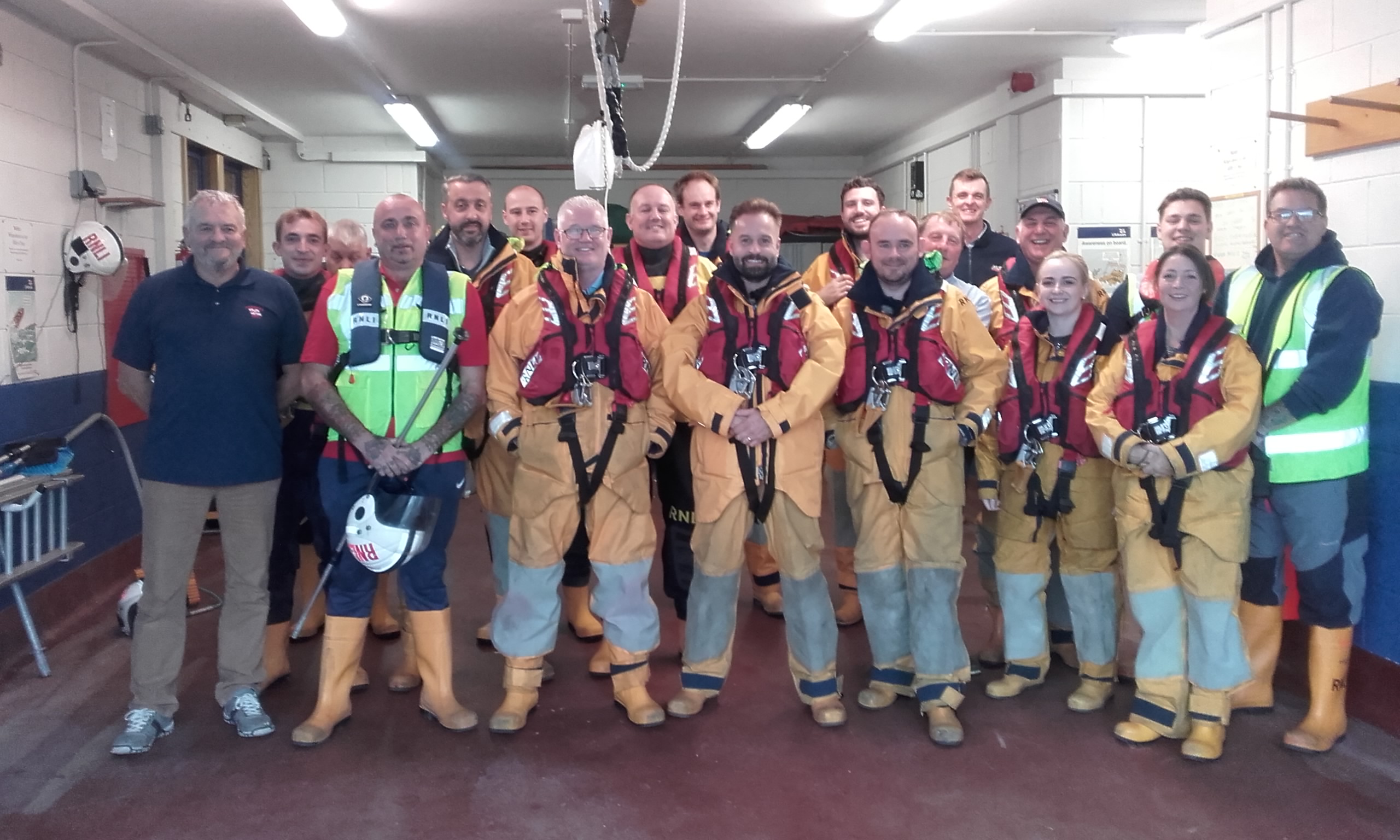 The lifeboat crew and volunteers with Alfie Boe, prior to their training exercise