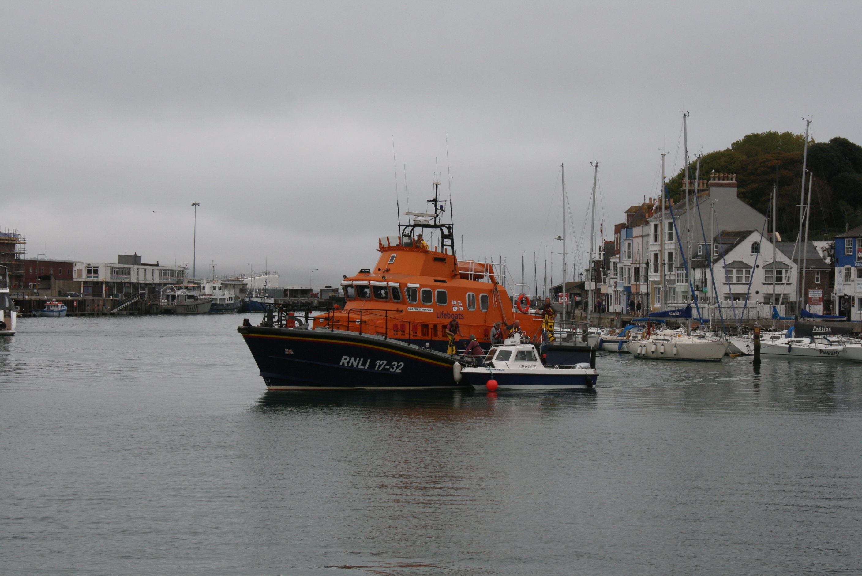 Weymouth RNLI lifeboat with casuality vessel alongside