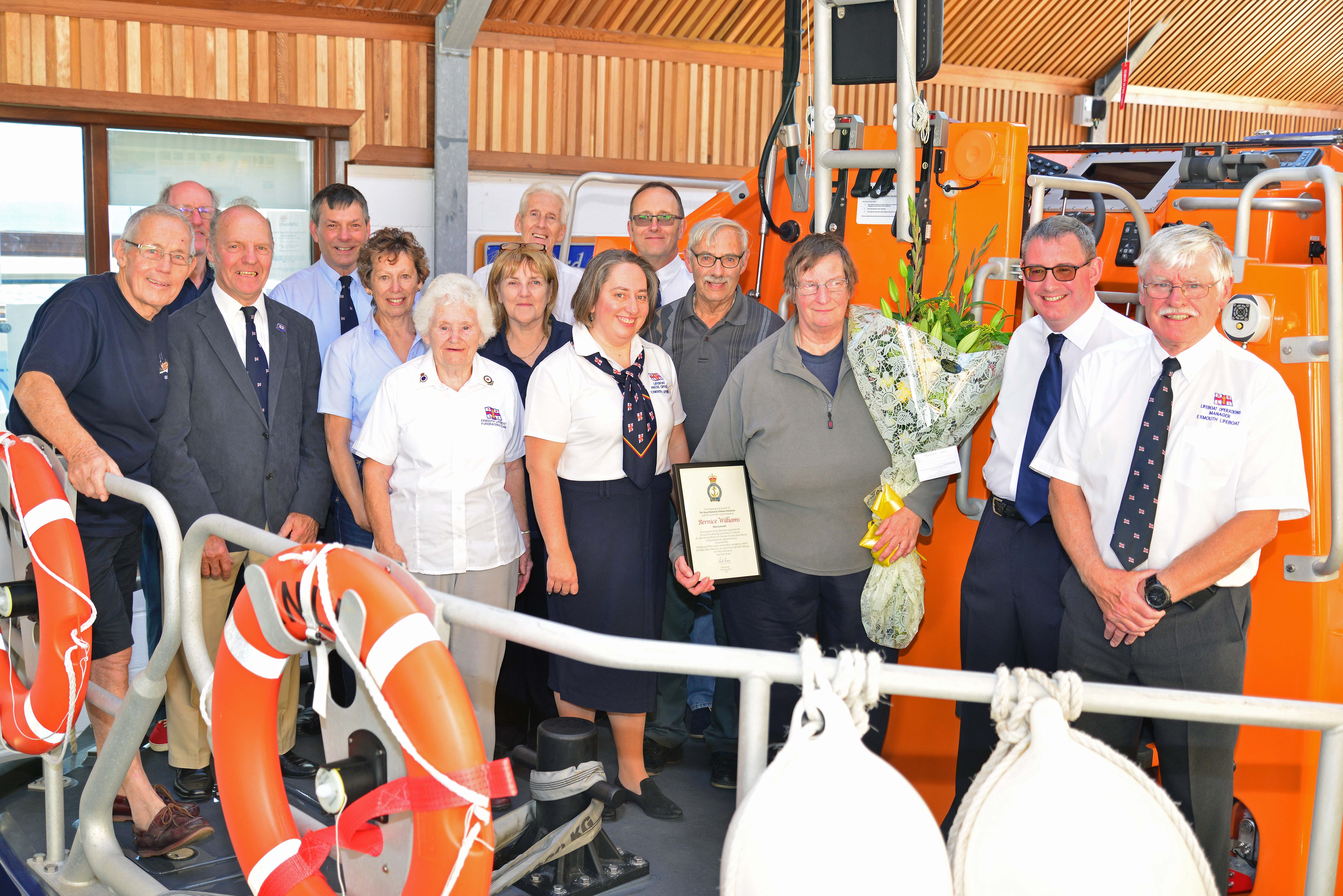 (L-R) Bill Lodge, Lifeboat Visits Officer; Dave Atkinson, Treasurer; Tom Chandler, former Crew; Dave Littlefield, Community Safety Officer; Linda Cawsey, Shop Manager; Maureen Chandler, Fundraising Team President; Pat Atkinson, Shop Manager; Don Hodgkinson, Box Secretary; Emma Tarling, Lifeboat Press Officer; Simon Davidson, Chair of LMG; Geoffrey Williams and Bernice Williams; Rory Carrig, Fundraising Chair and Kevin Riley, Lifeboat Operations Manager.