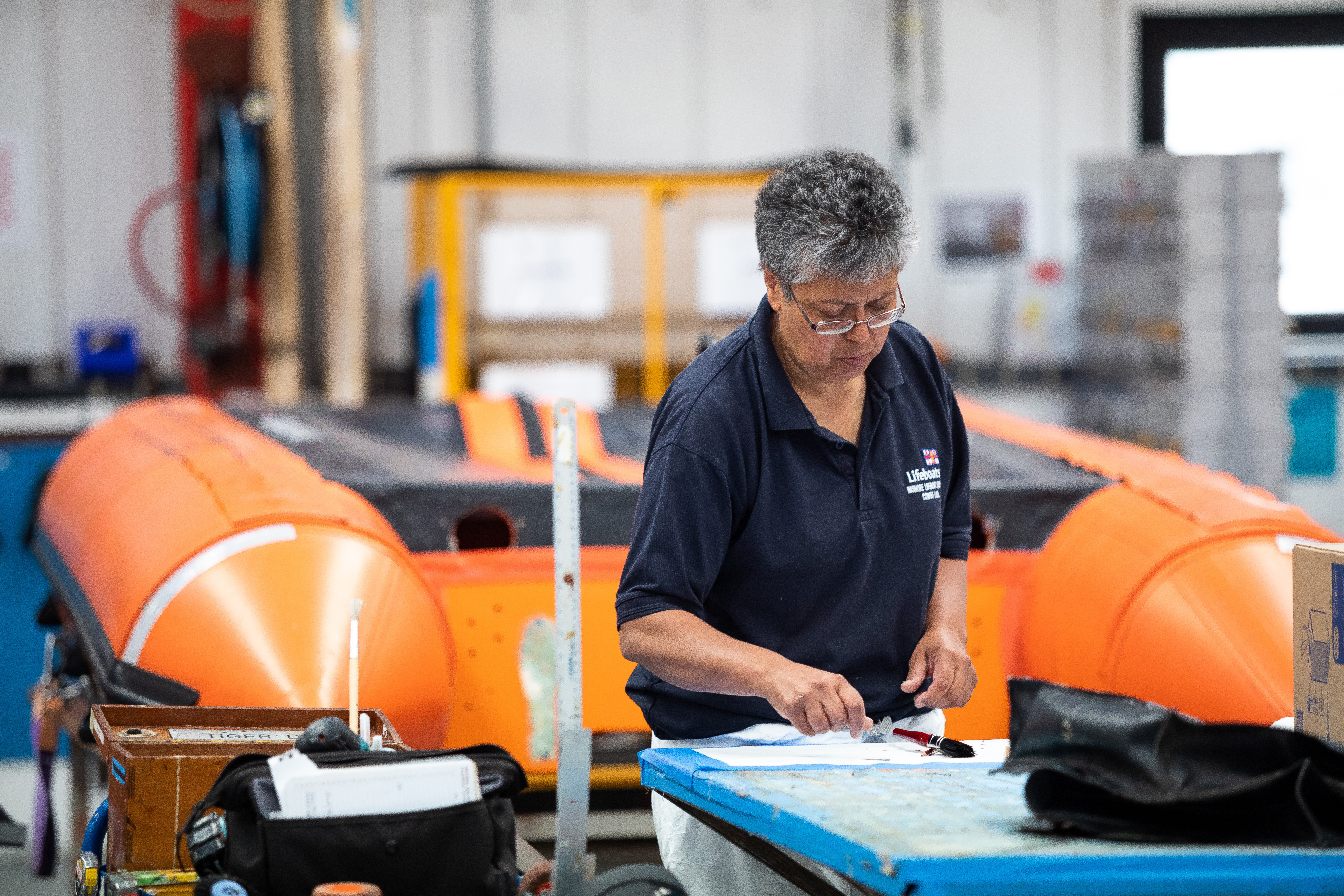 A Solutionist works on fittings for an inshore lifeboat