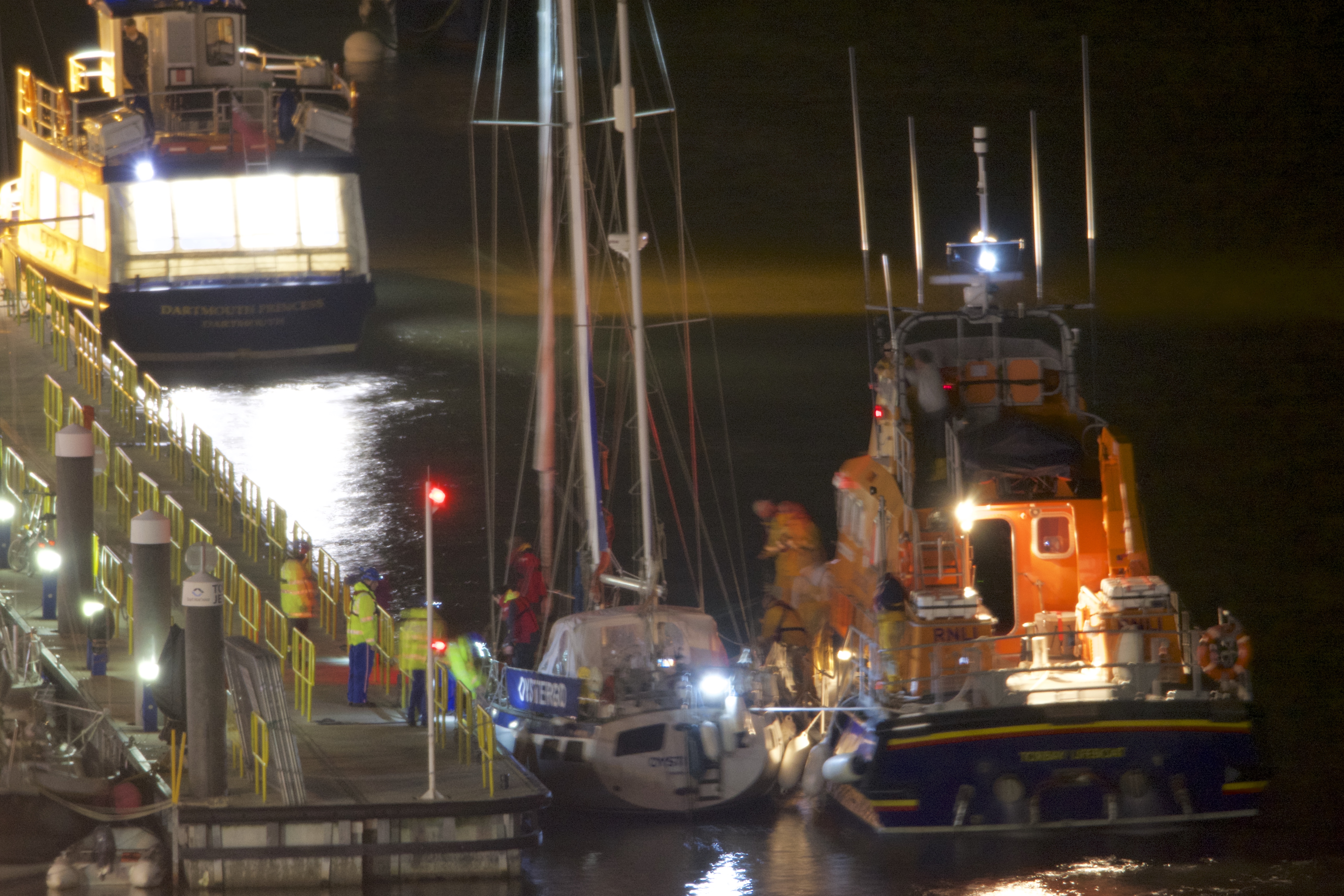 The RNLI Torbay all-weather lifeboat brings the sailing vessel into Dartmouth