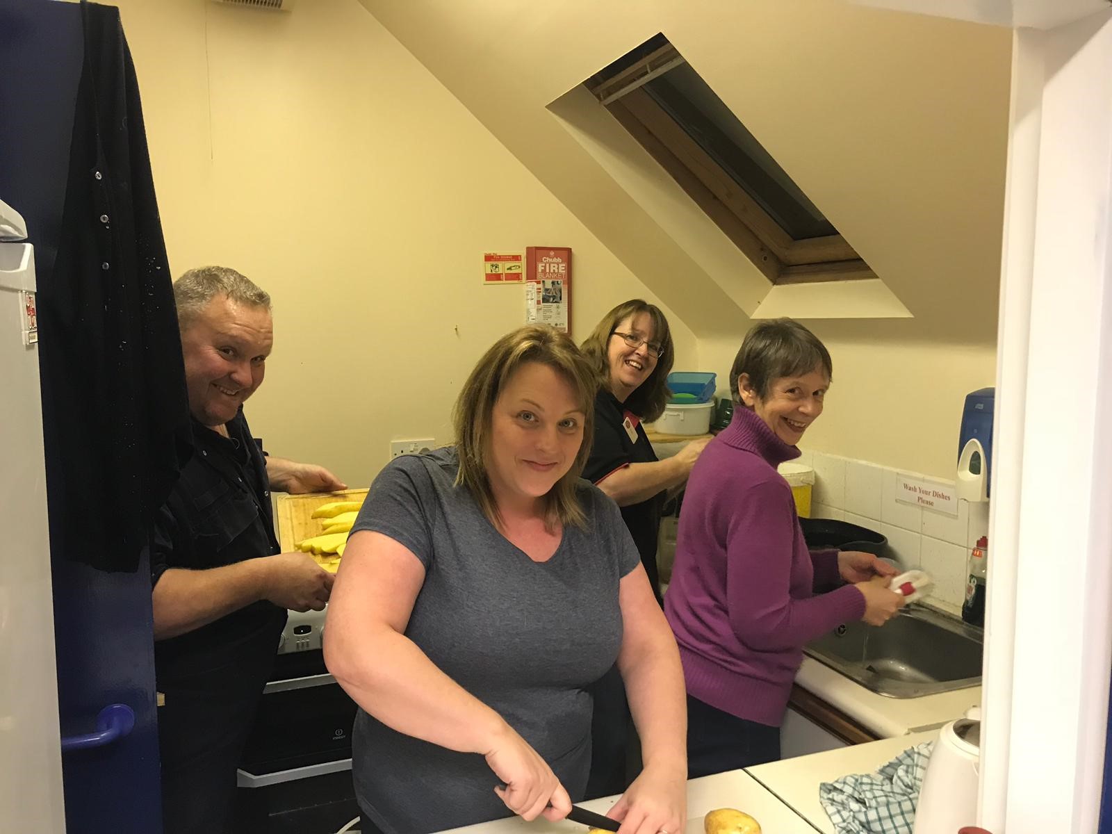 Tobermory RNLI crew, fundraisers and family prepare 90kg of potatoes for Fish Supper