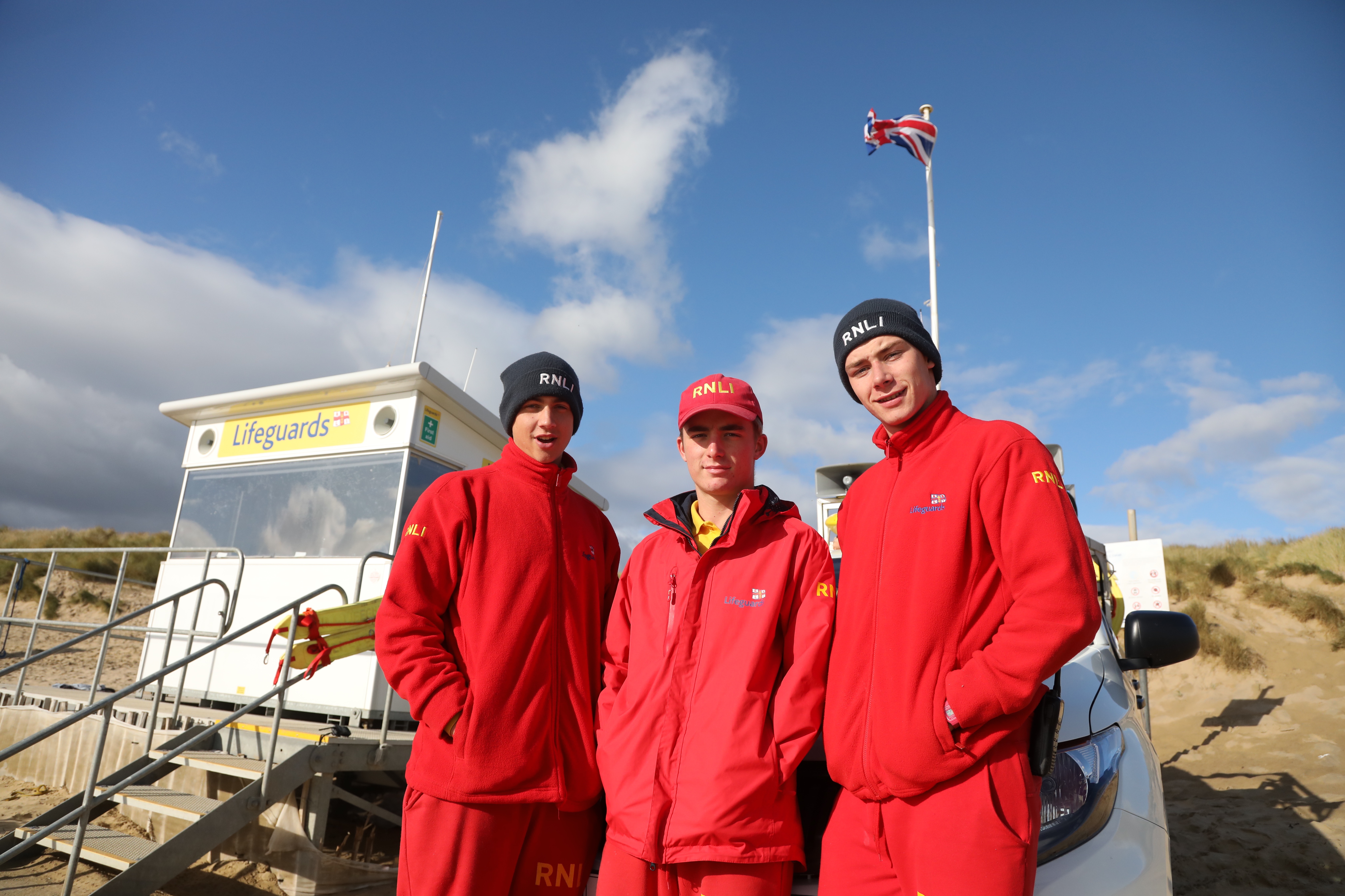 three lifeguards at Camber sands