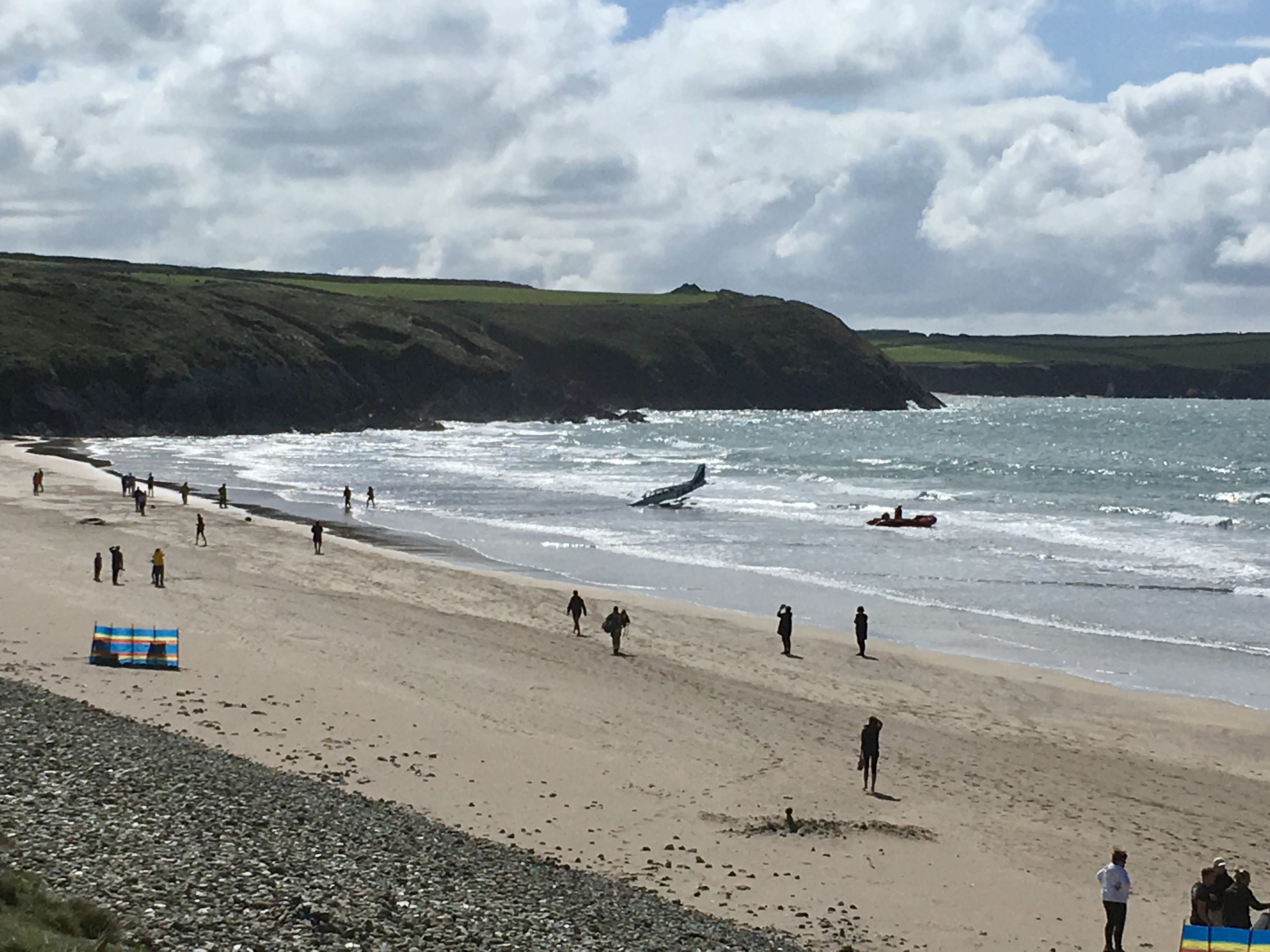 Plane ditched yards from the shoreline