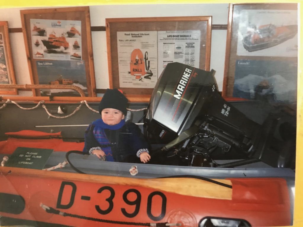 Sam Williams as a child on the D Class lifeboat at Porthcawl's old lifeboat station