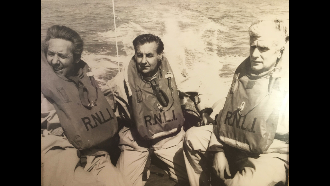three RNLi crew from the 1960's in the Harbour