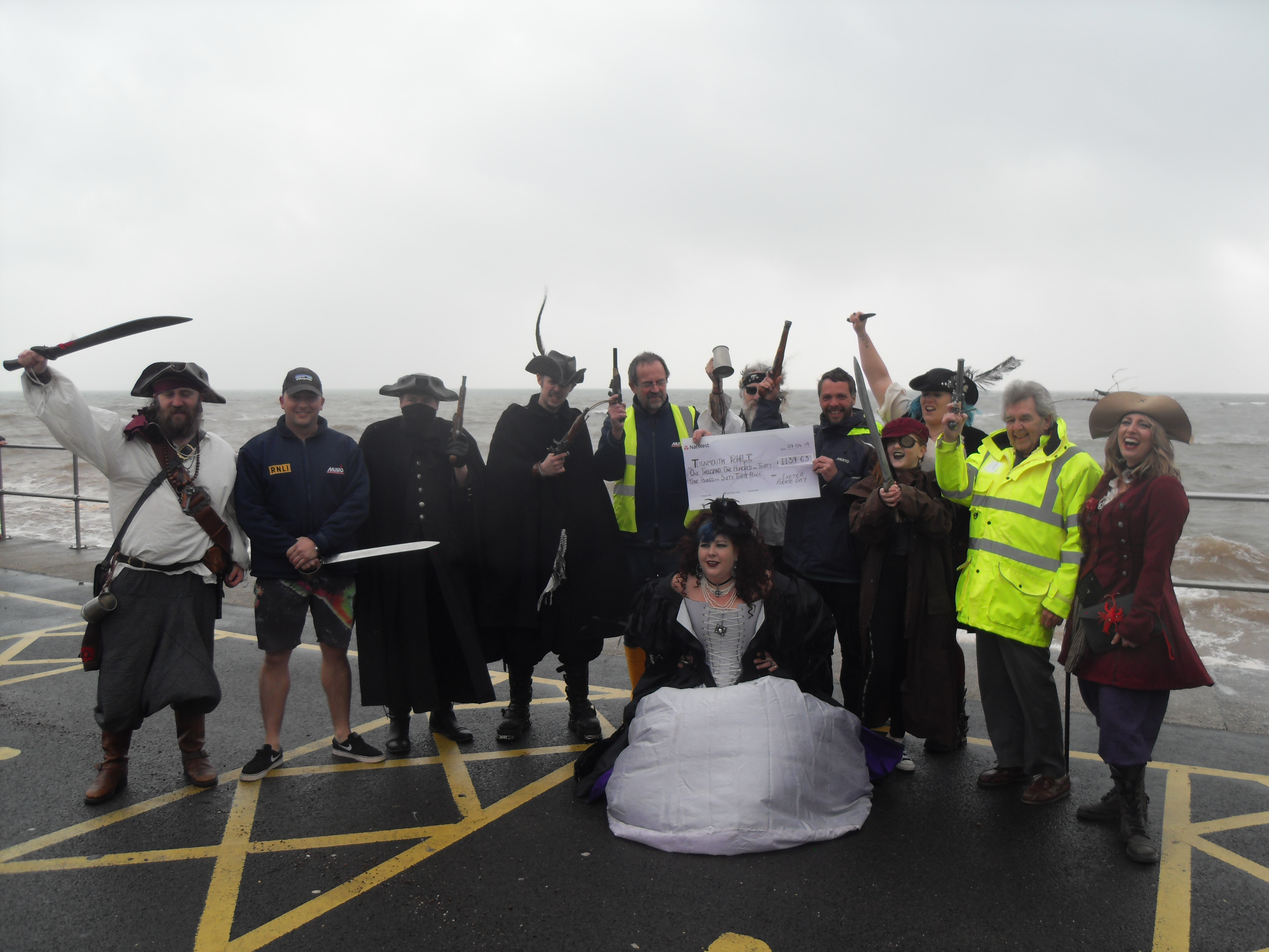 Crew of Exeter Pirate Day with volunteers of Teignmouth lifeboat crew